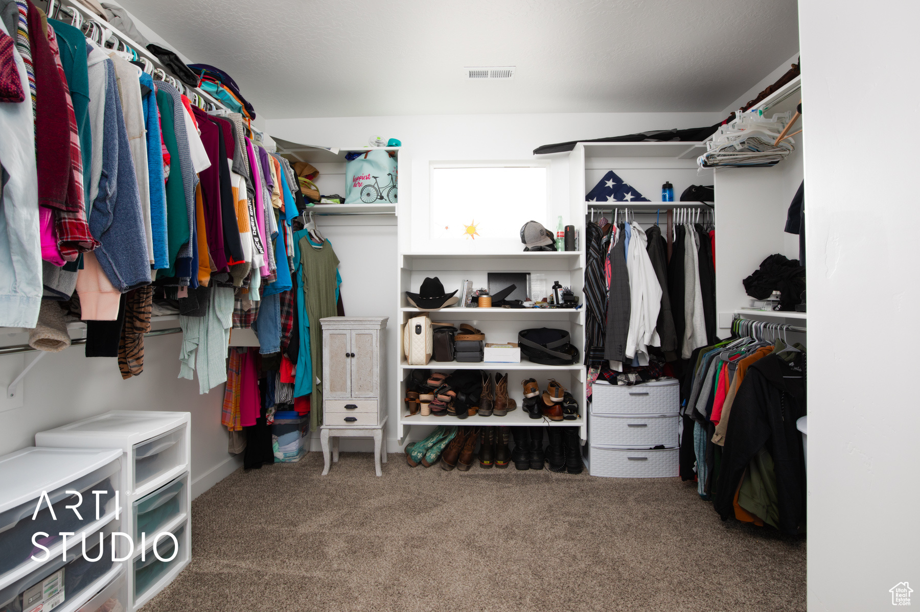 Spacious closet with carpet