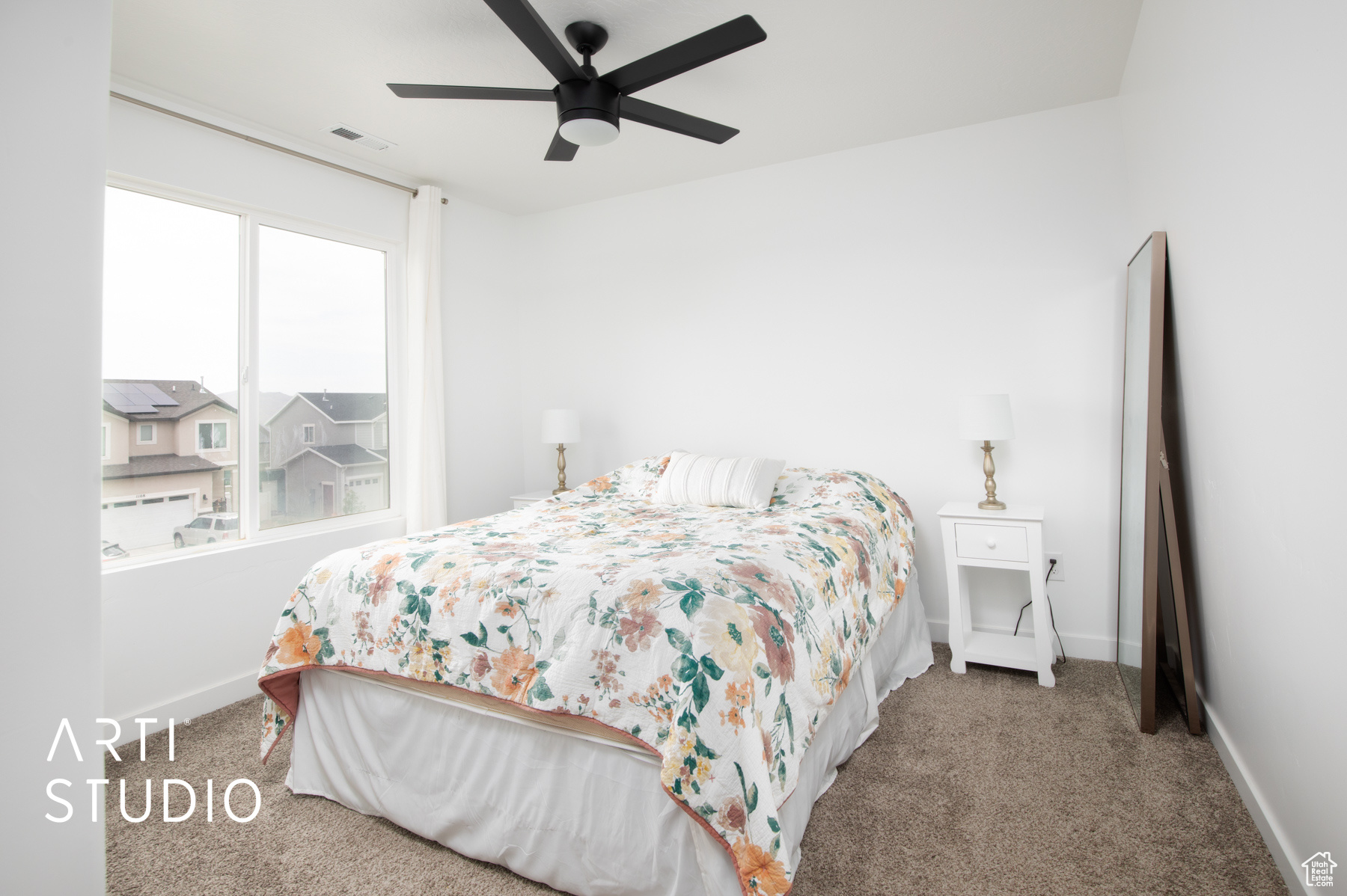 Bedroom featuring ceiling fan and carpet