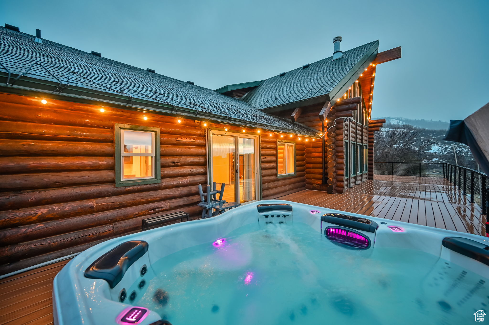 View of pool with an outdoor hot tub