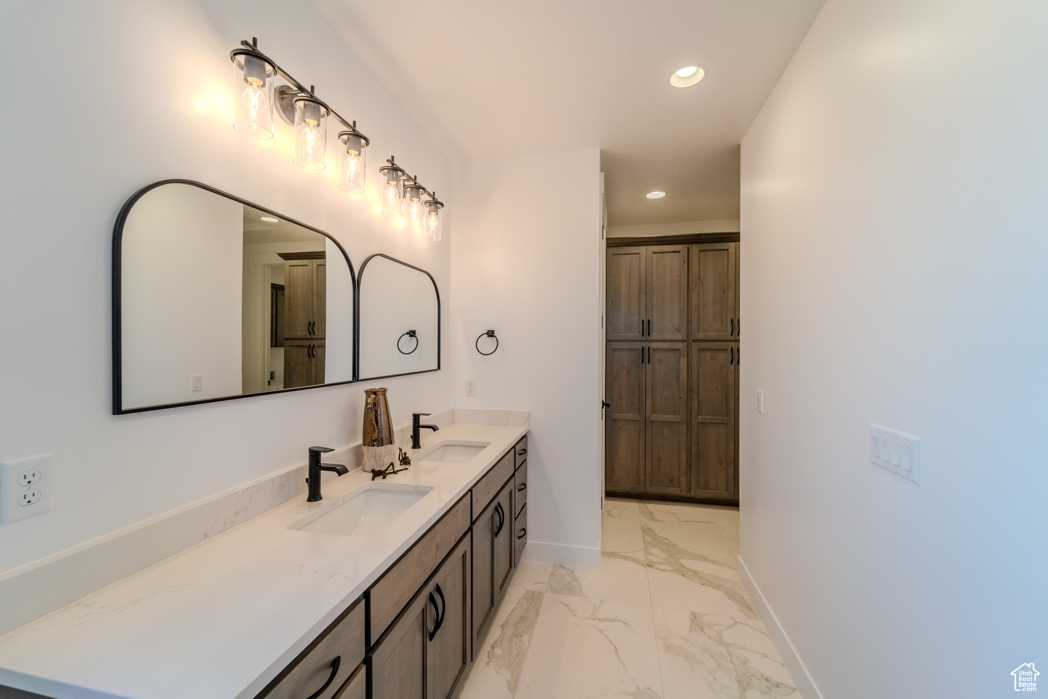 Bathroom with tile patterned flooring and vanity