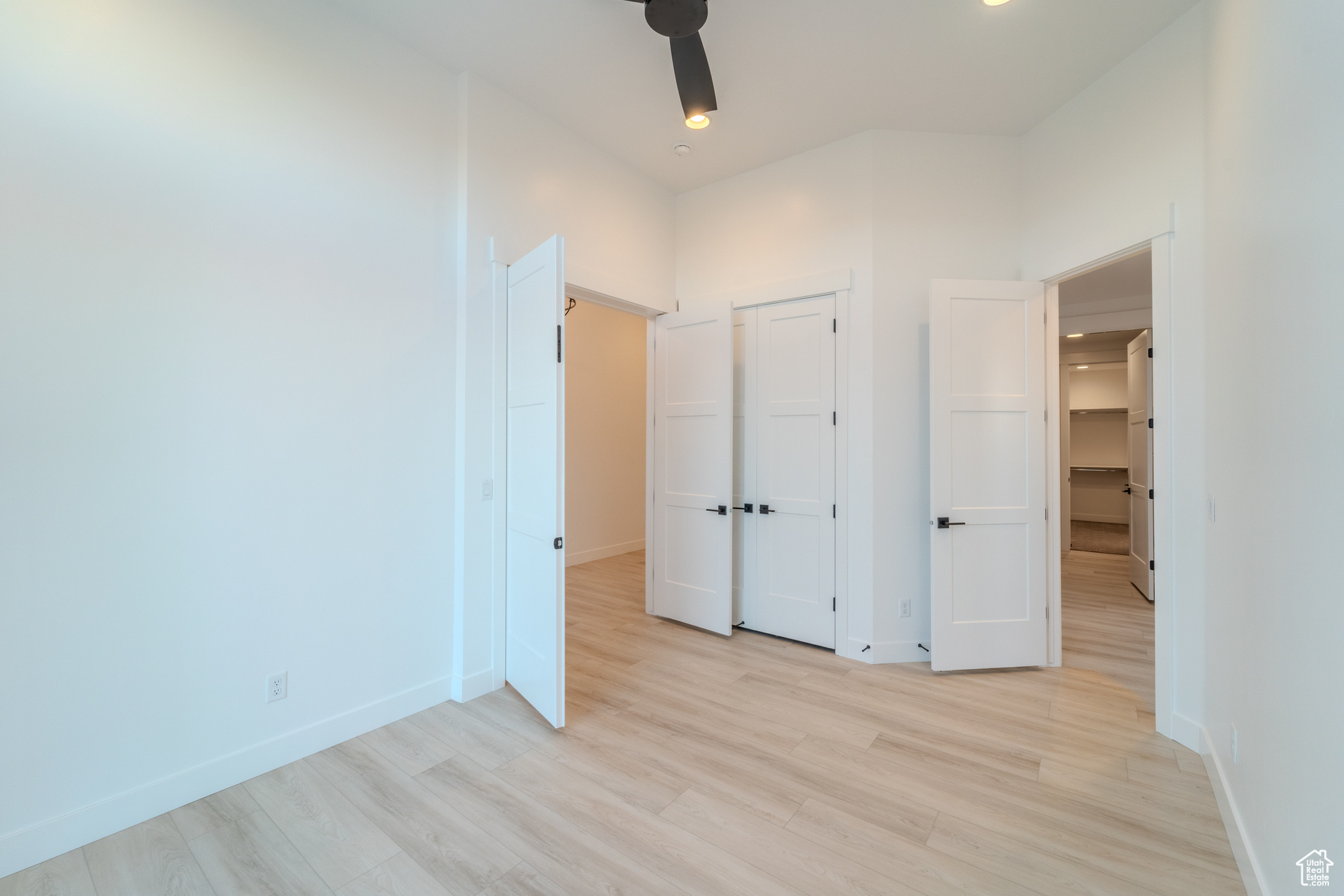 Unfurnished bedroom featuring light wood-type flooring and a closet