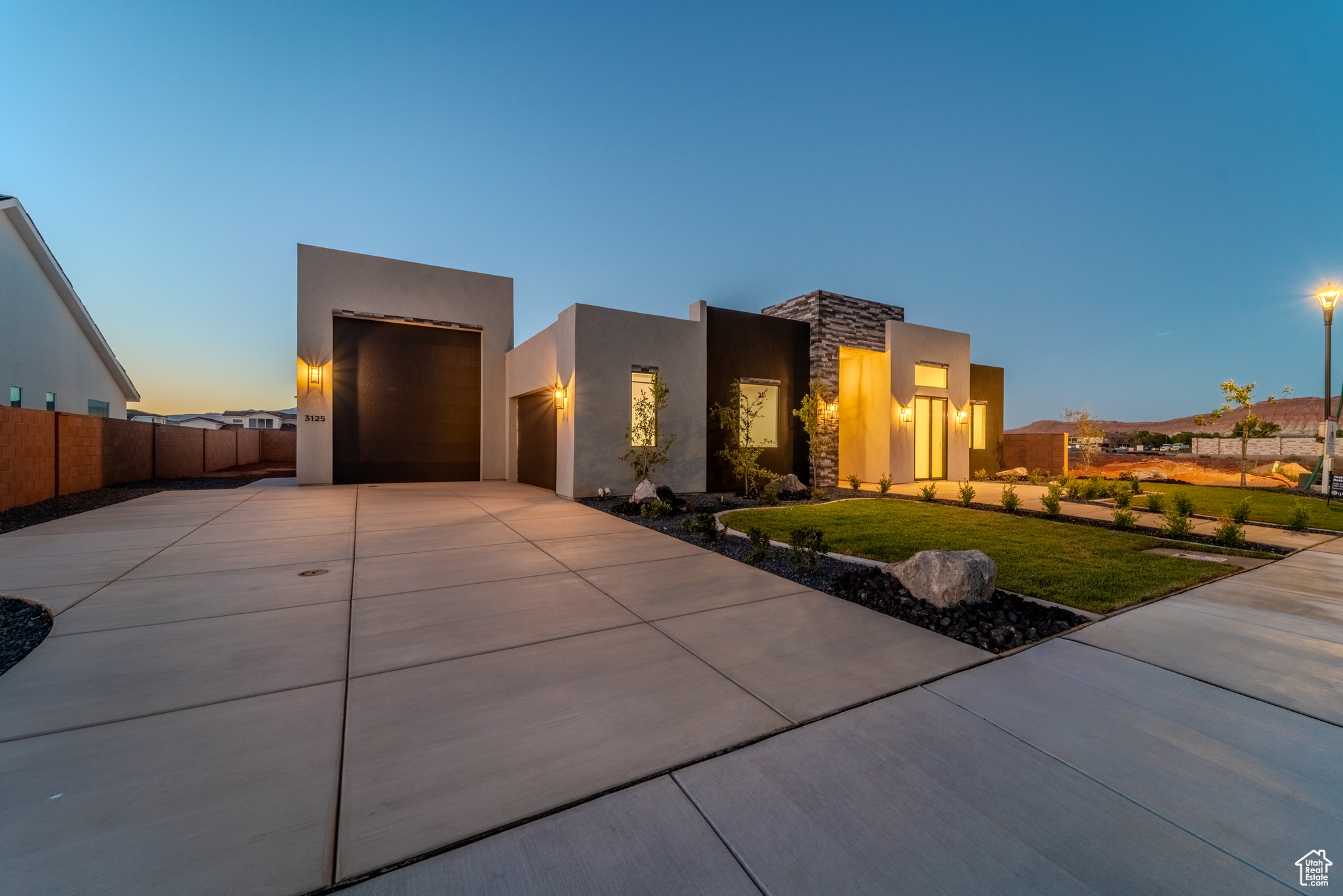 View of front of property with a lawn