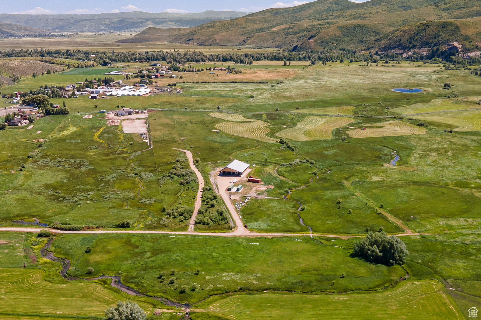 Aerial view featuring a rural view and a mountain view