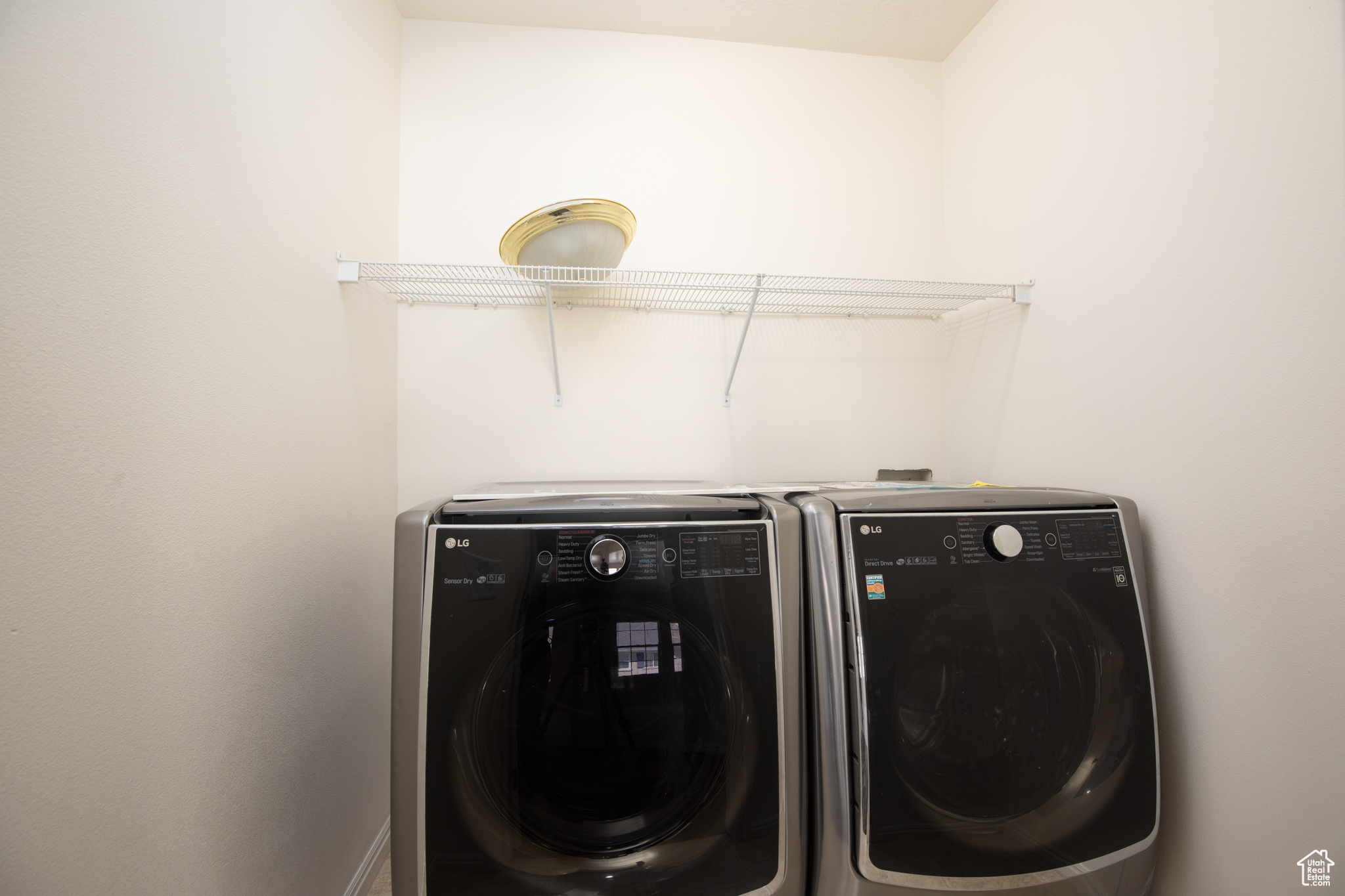 Clothes washing area with washer and dryer
