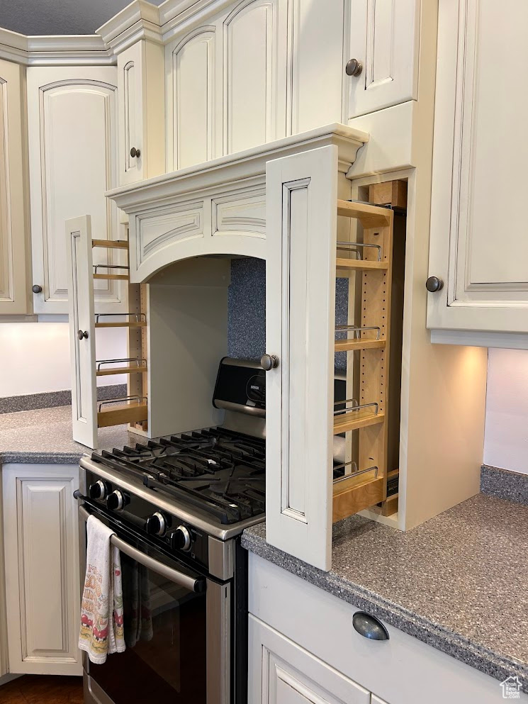 Kitchen with range with gas cooktop