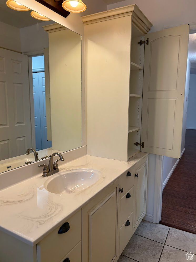 Bathroom with vanity and tile patterned floors