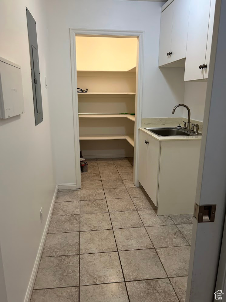 Laundry room with sink and electric panel