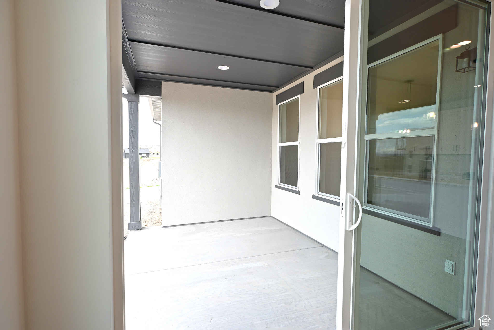 big covered patio from sliding glass door.