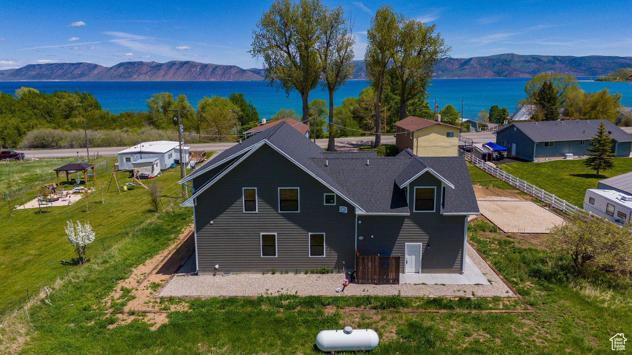 Drone / aerial view with a water and mountain view