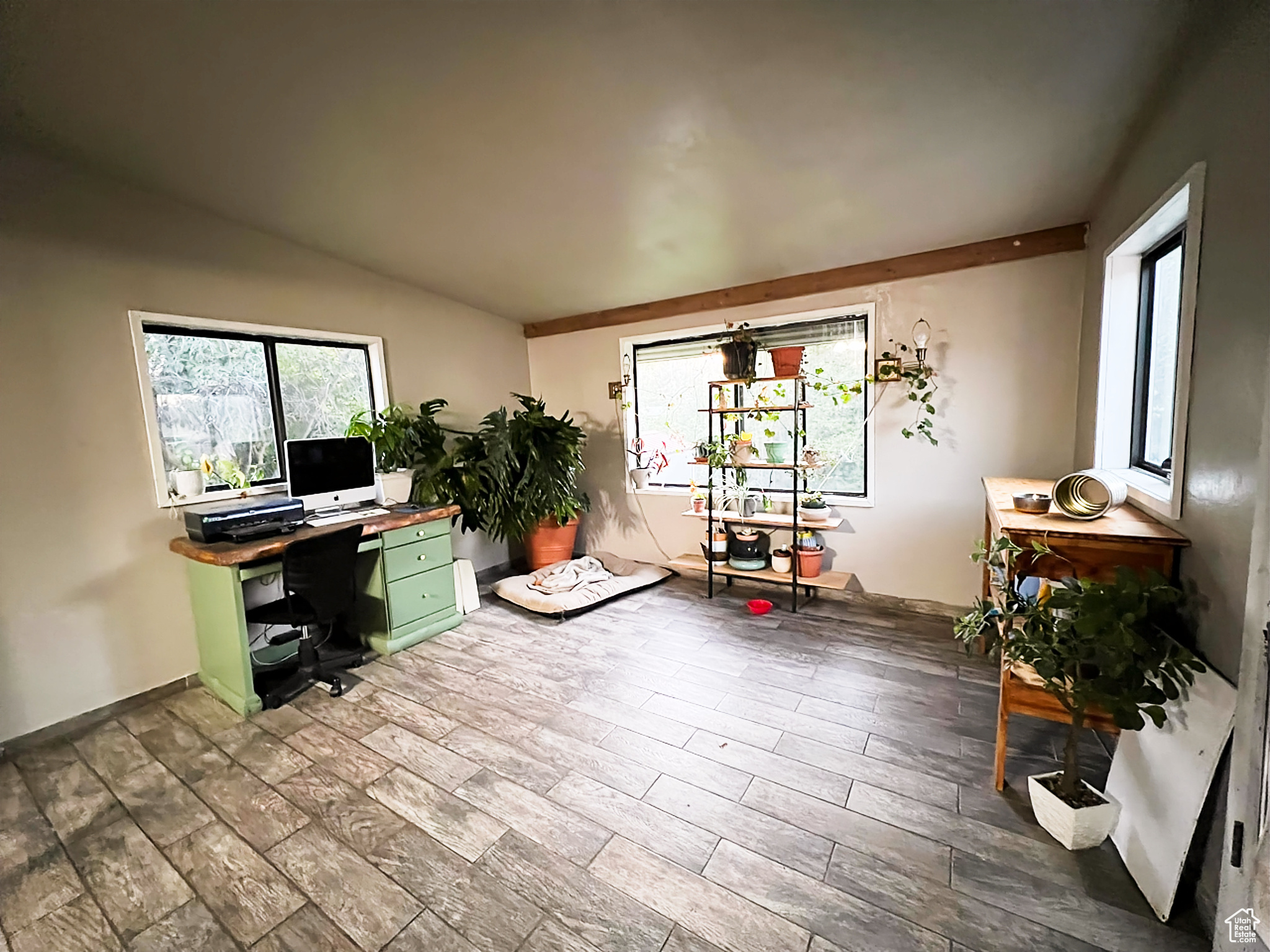 Miscellaneous room with hardwood / wood-style floors and vaulted ceiling