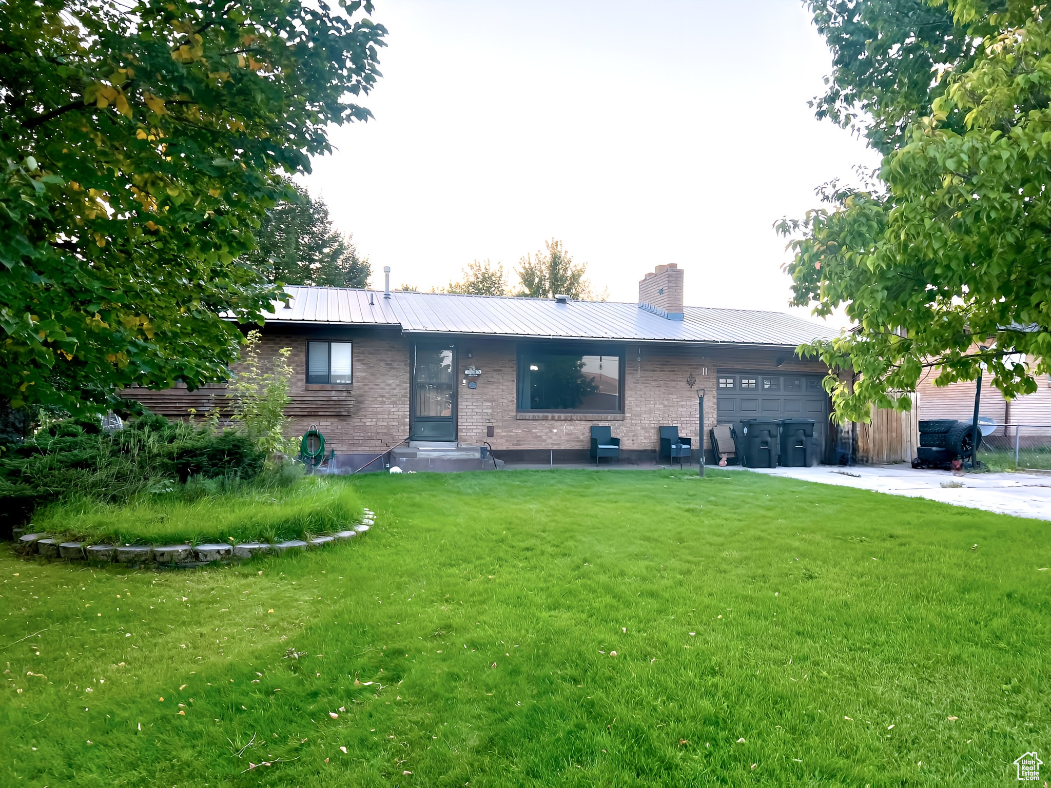 Ranch-style house with a front lawn