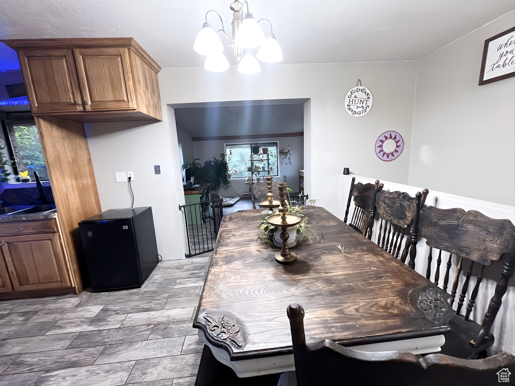 Dining room featuring a wealth of natural light and a chandelier