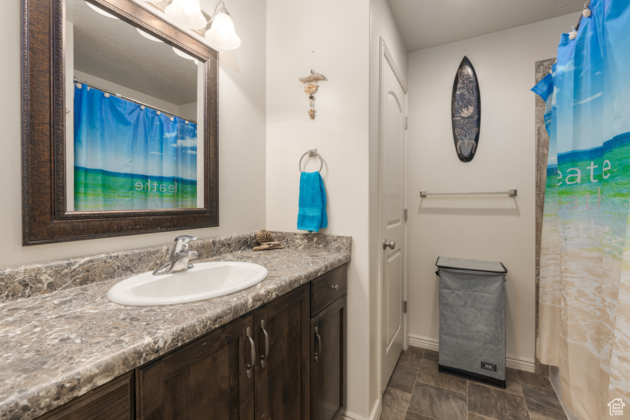 Bathroom featuring tile flooring and vanity