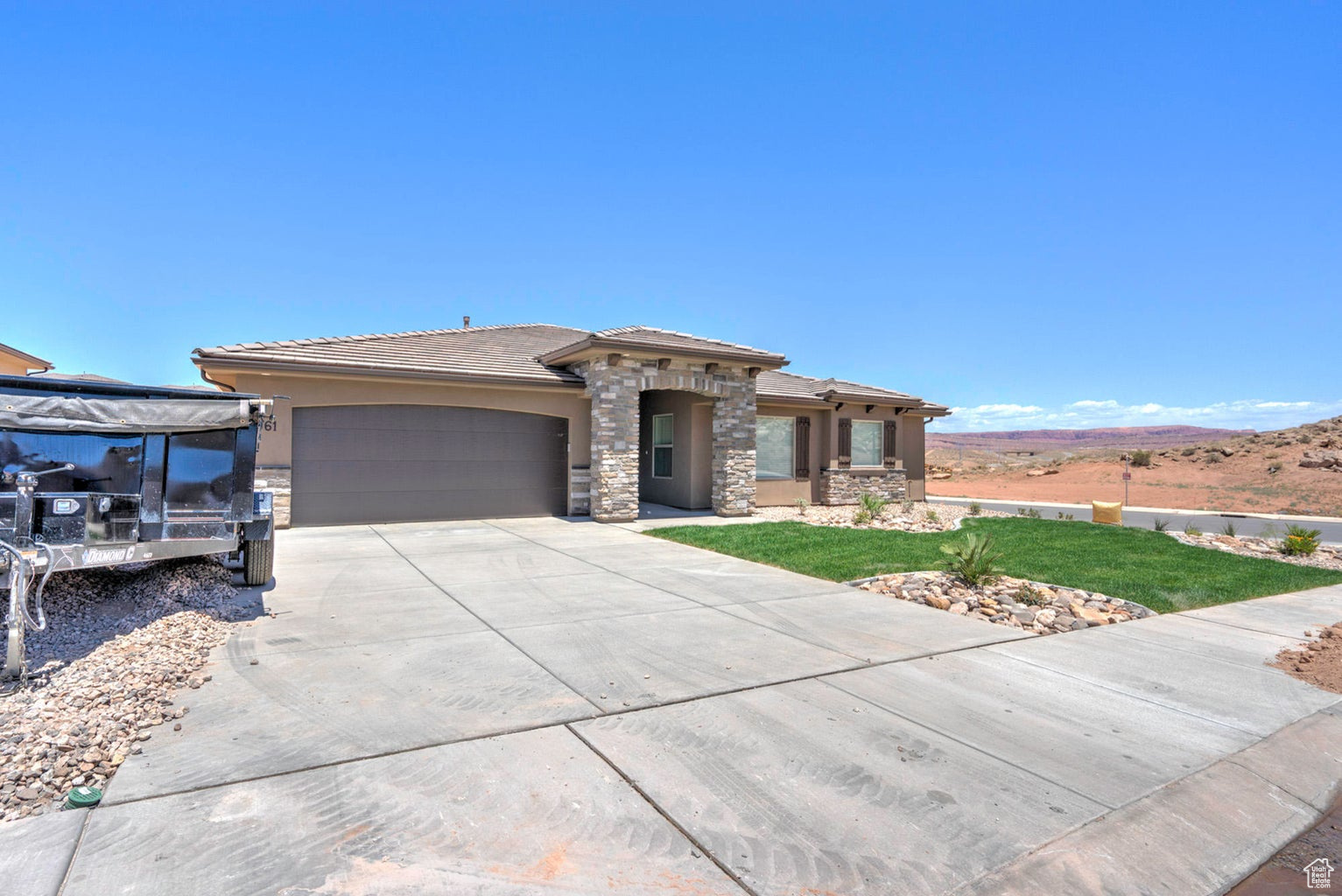 Prairie-style home featuring a garage