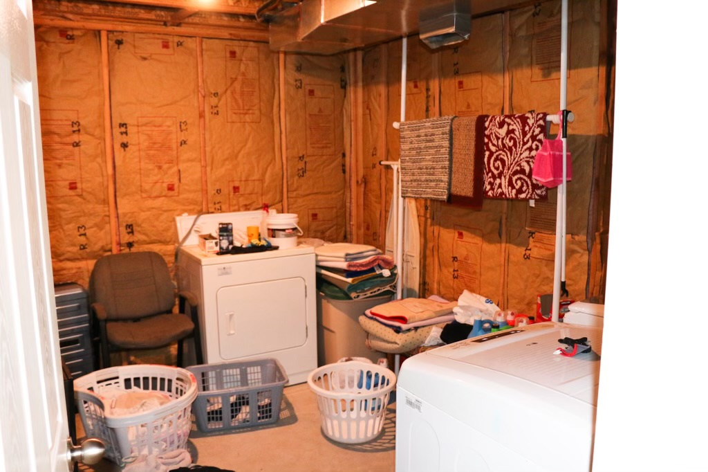 Interior space with wood walls and washer / dryer