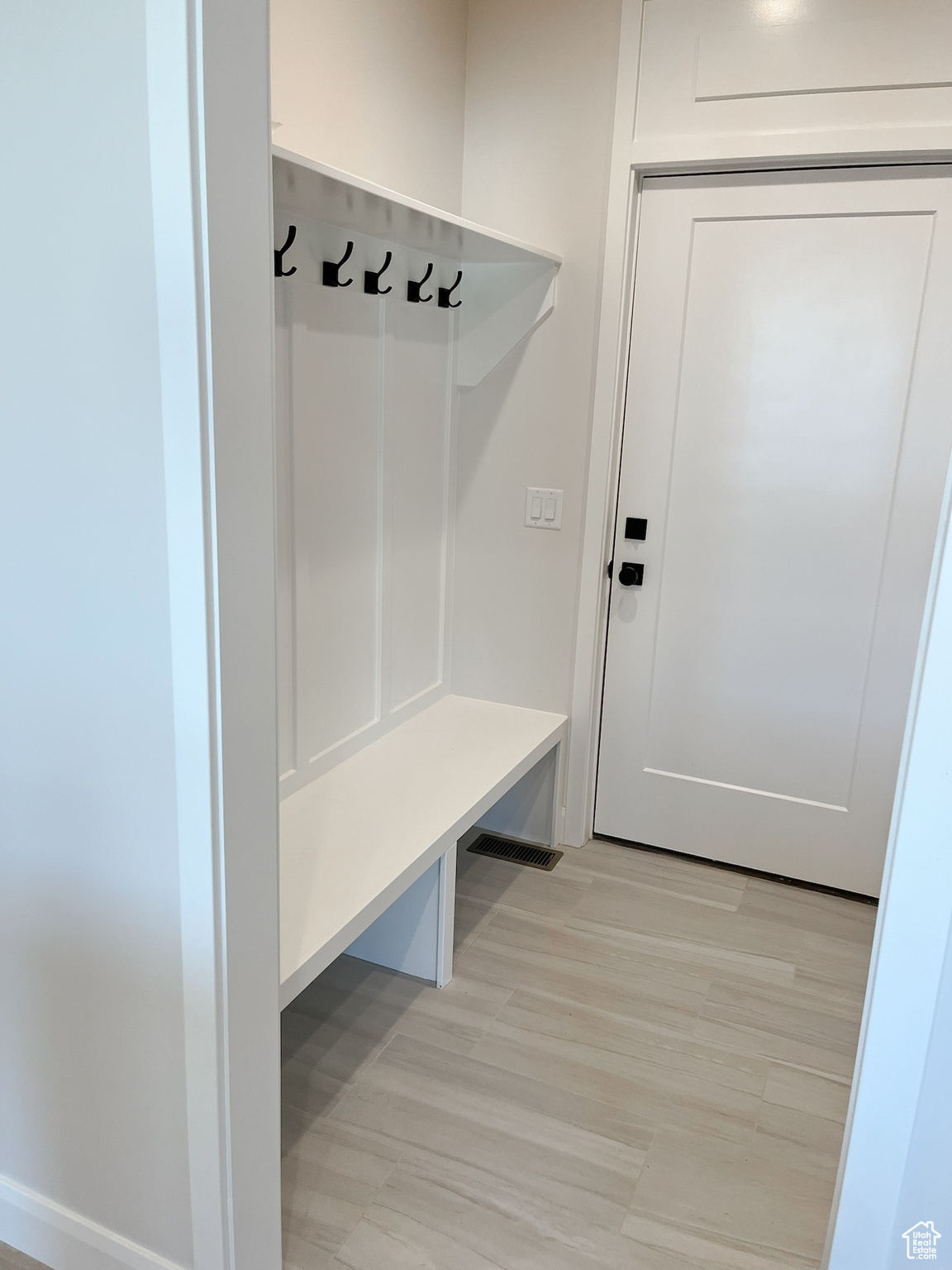 Mudroom with light wood-type flooring