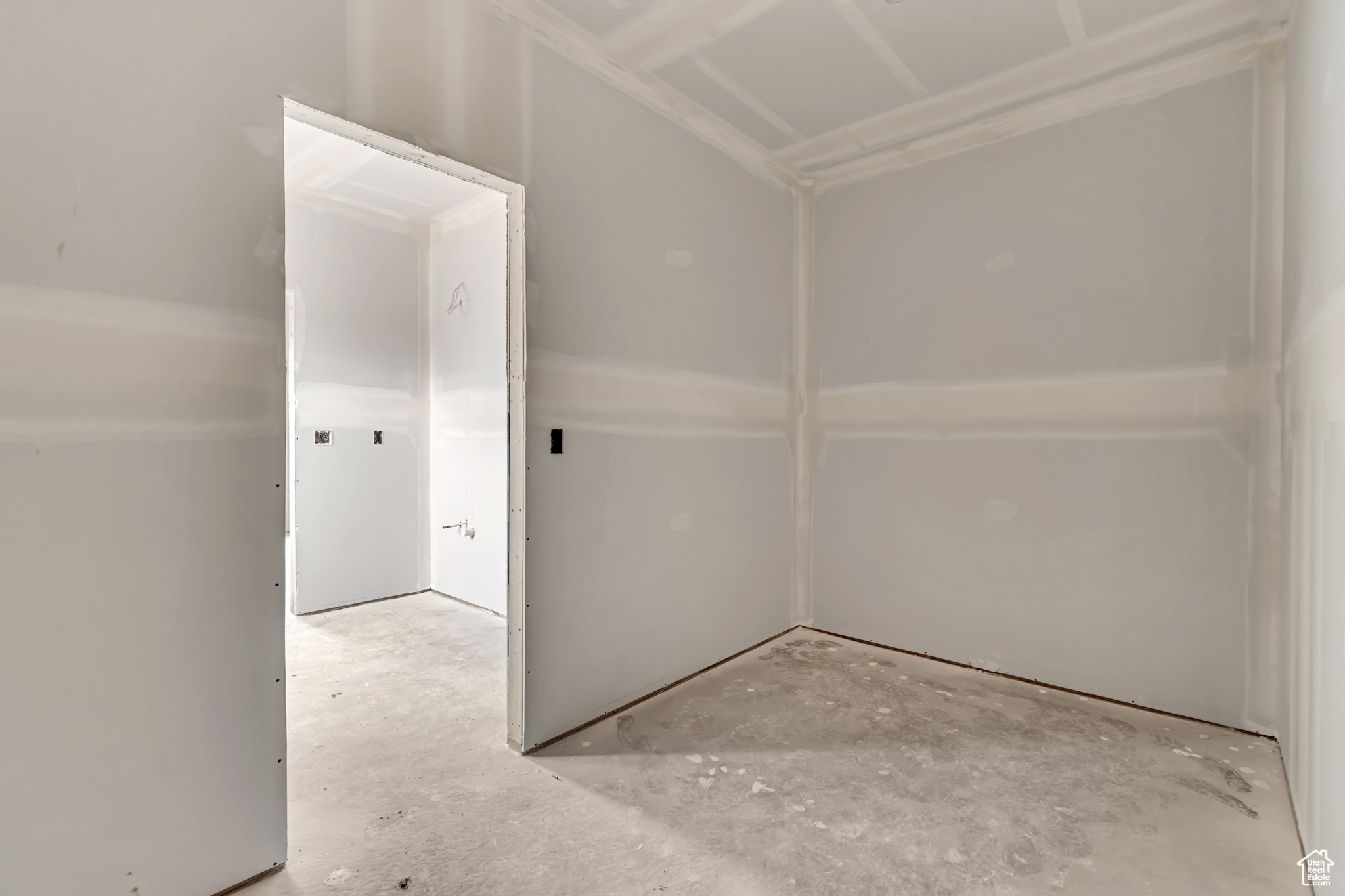 Unfurnished room with concrete floors