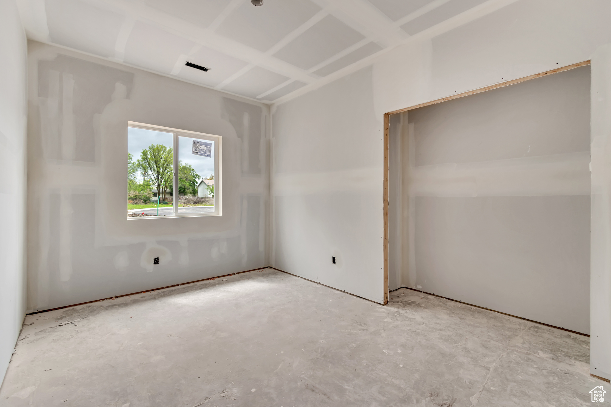 Spare room with concrete floors