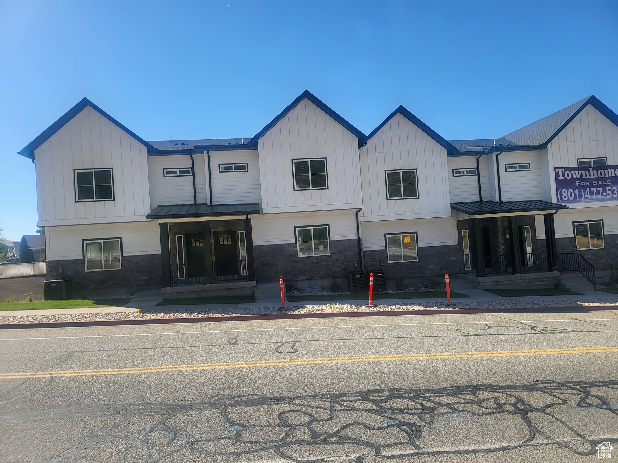 View of front of property with central AC unit