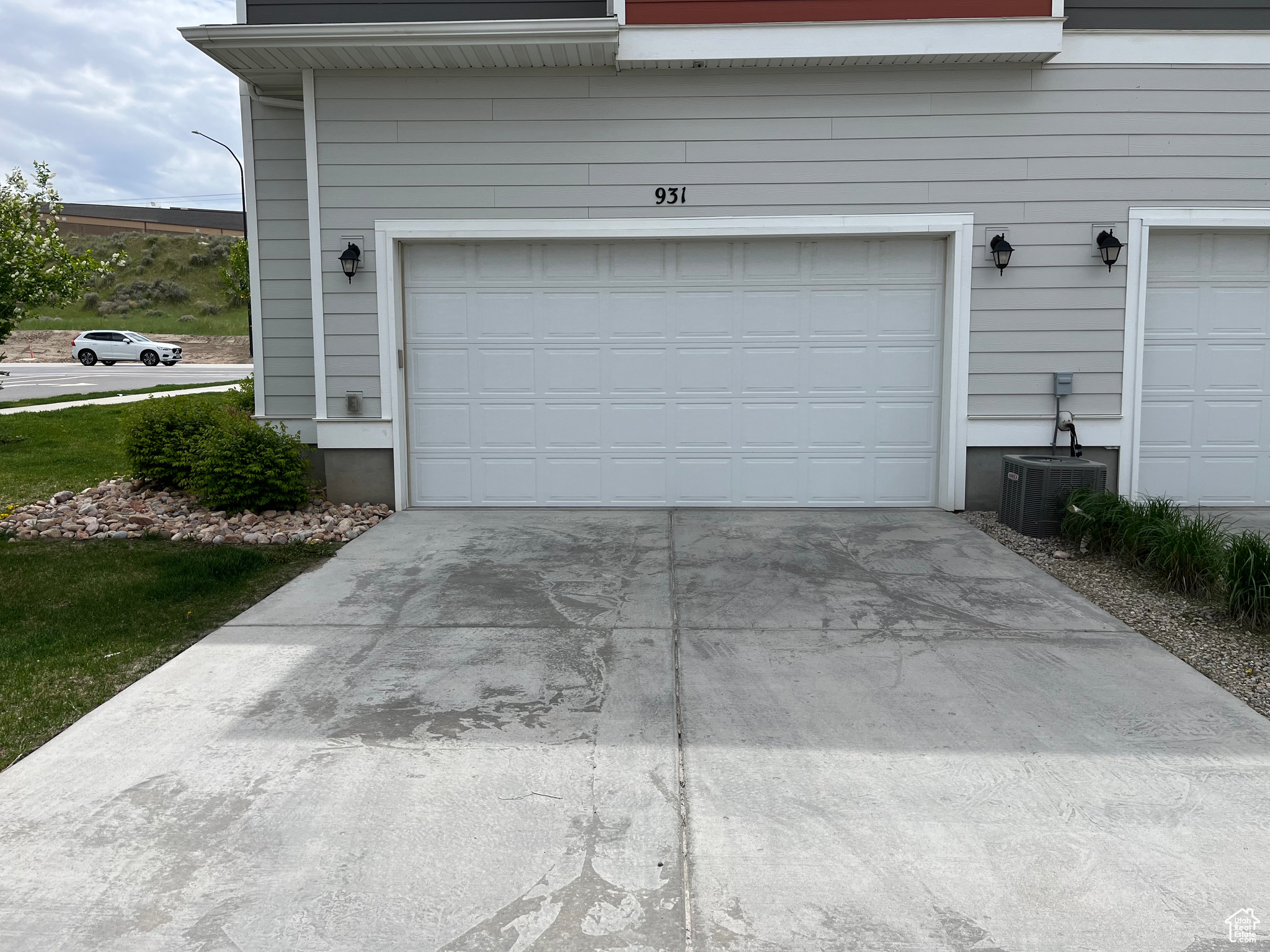 Garage featuring full size driveway