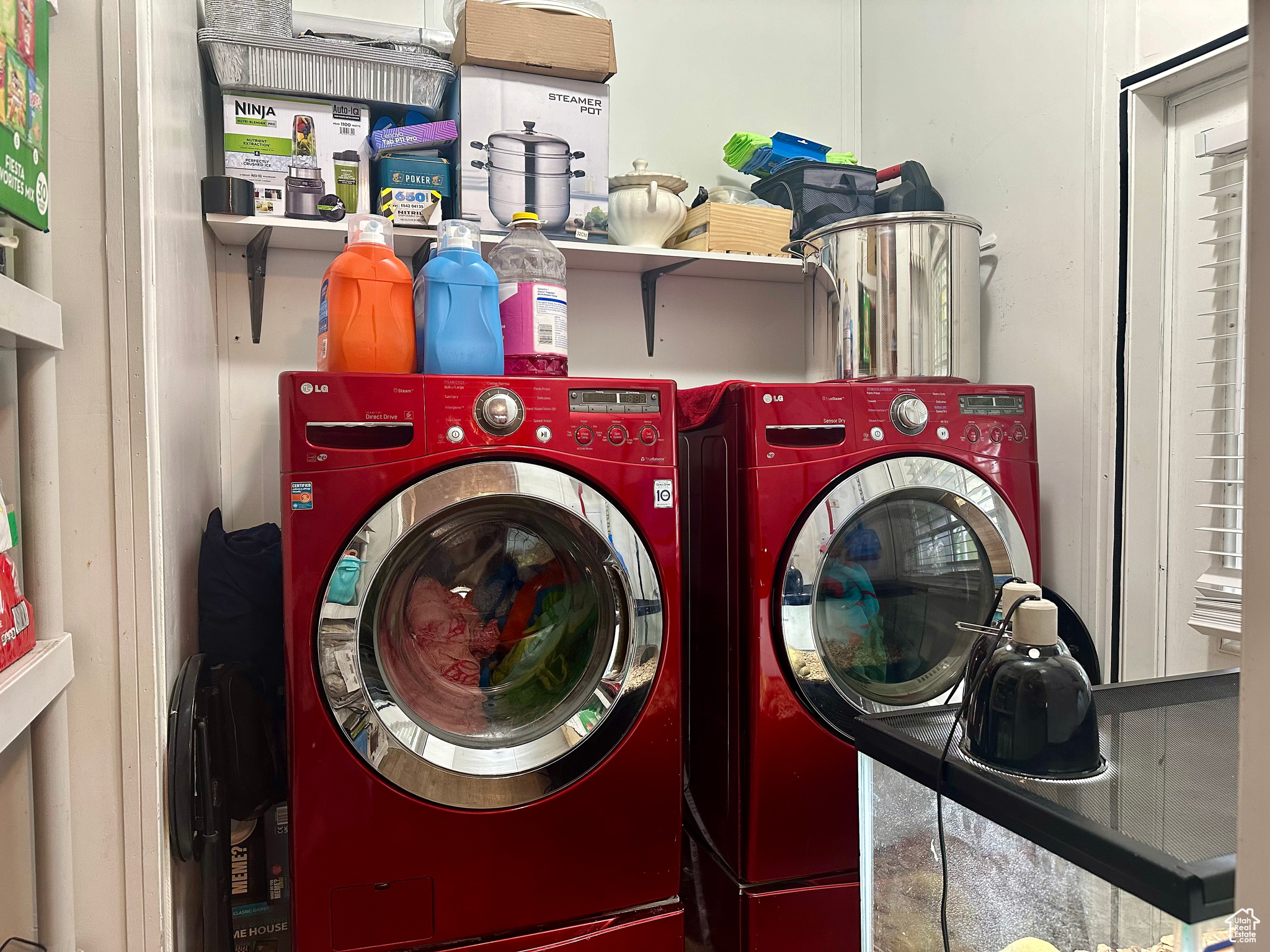 Laundry room featuring washer and clothes dryer next to door to the backyard