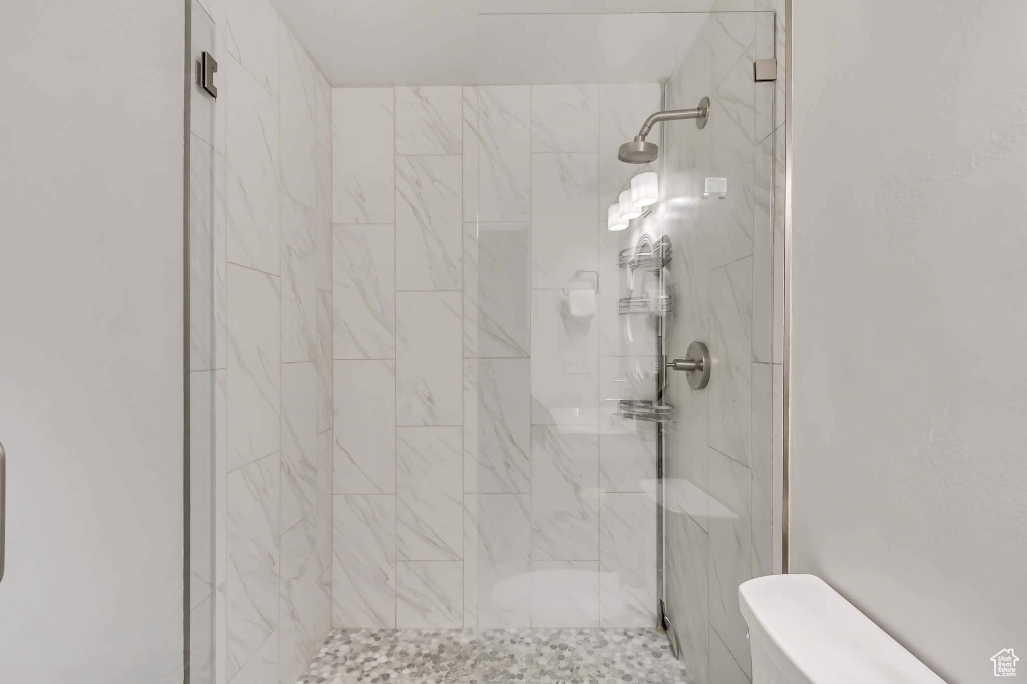 Bathroom with tiled shower and toilet