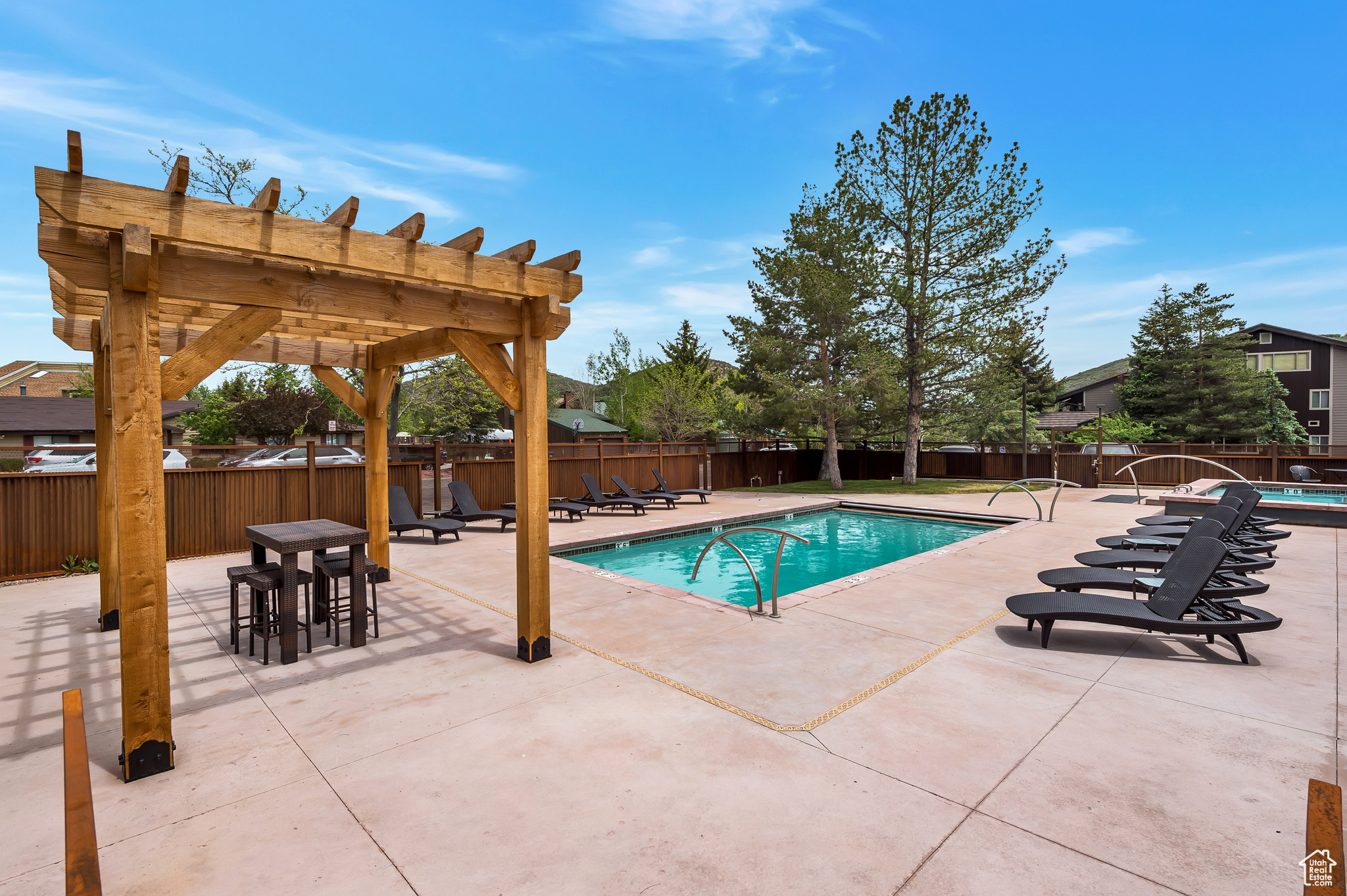 View of pool featuring a patio and a pergola