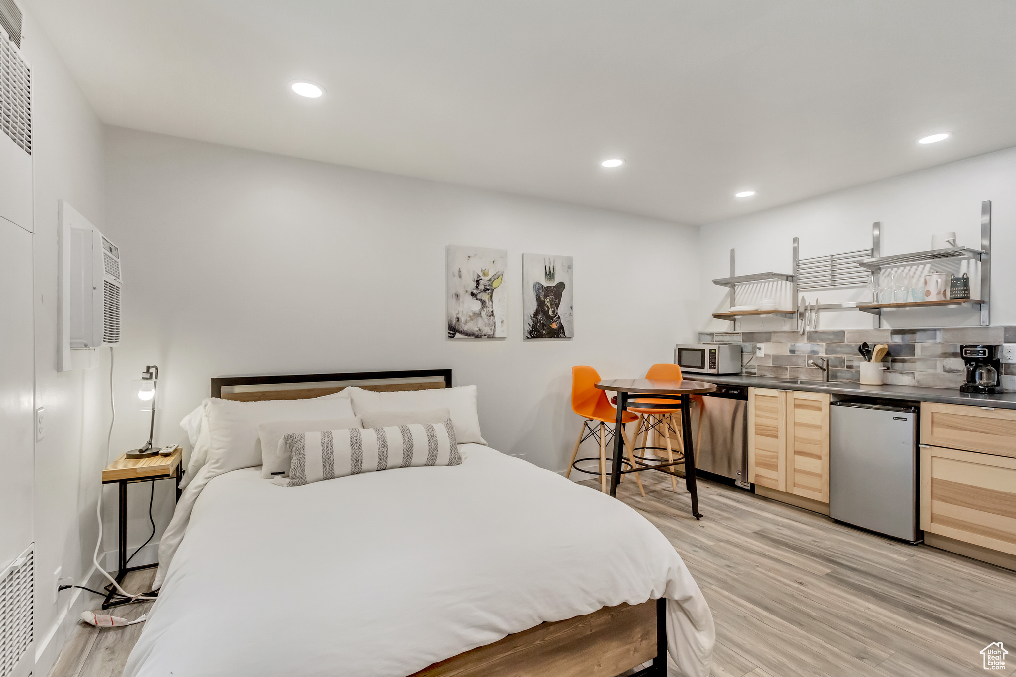 Bedroom featuring sink and light hardwood / wood-style floors