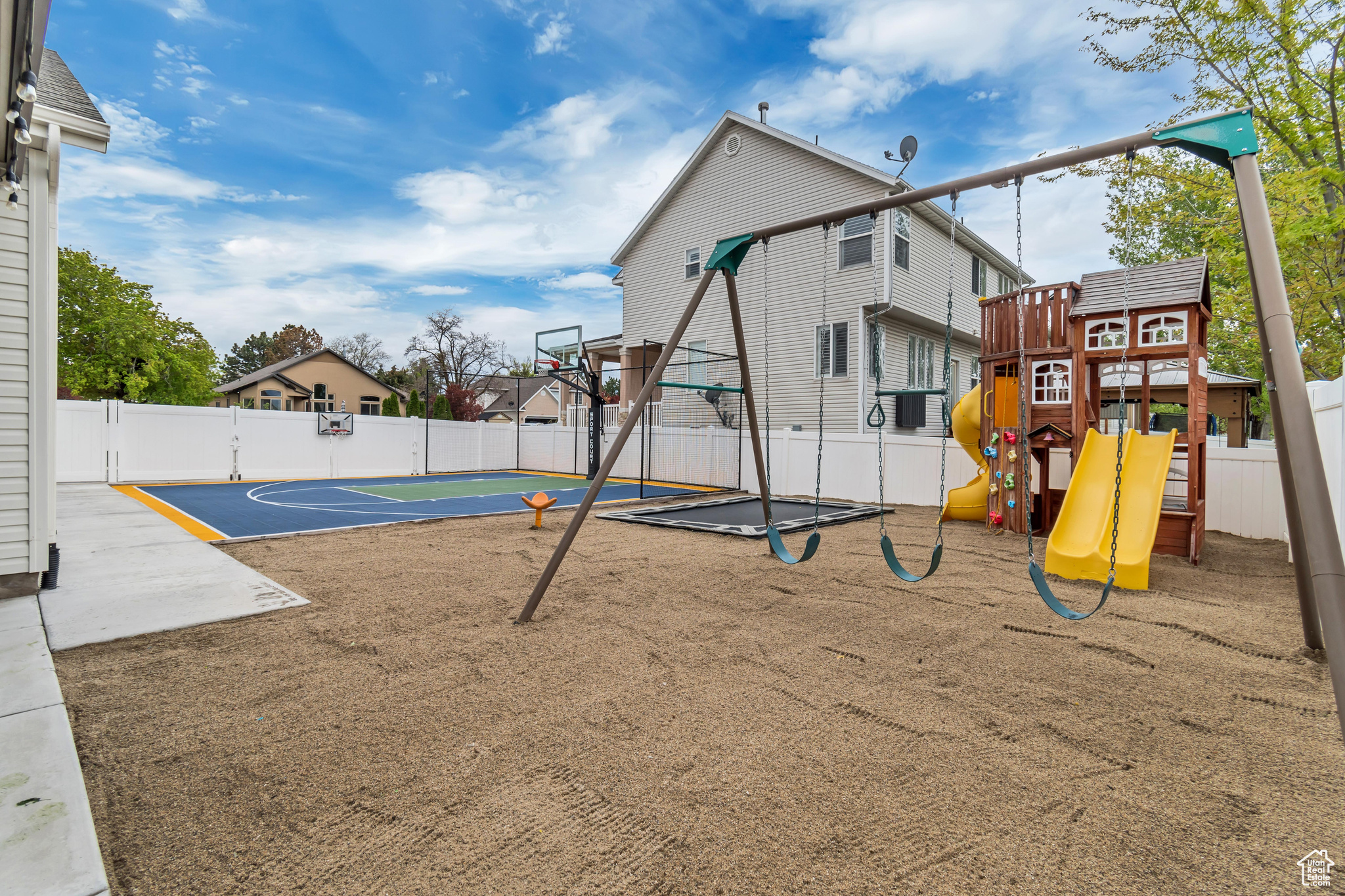 View of playground featuring basketball hoop