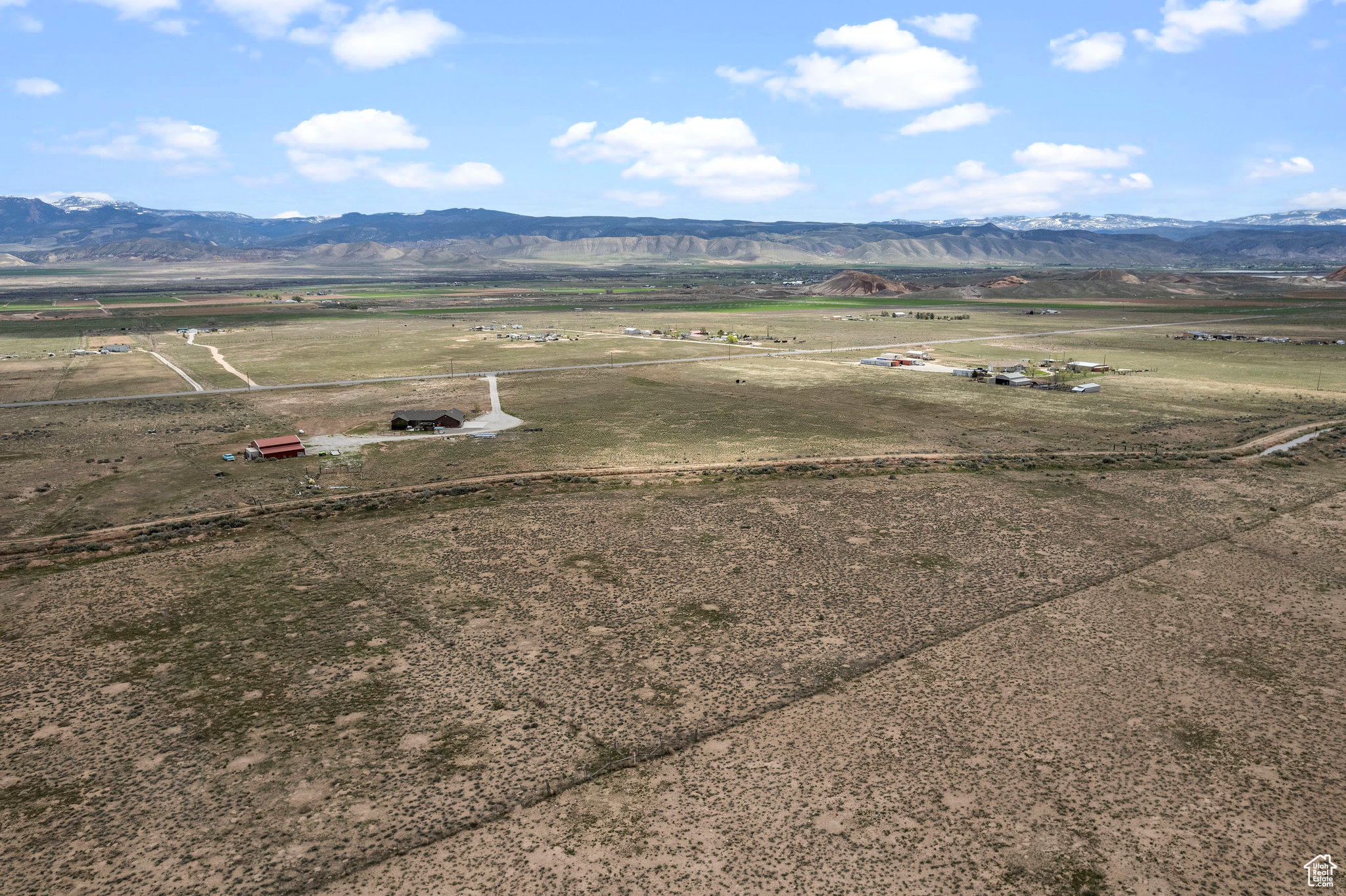 Drone / aerial view with a mountain view and a rural view