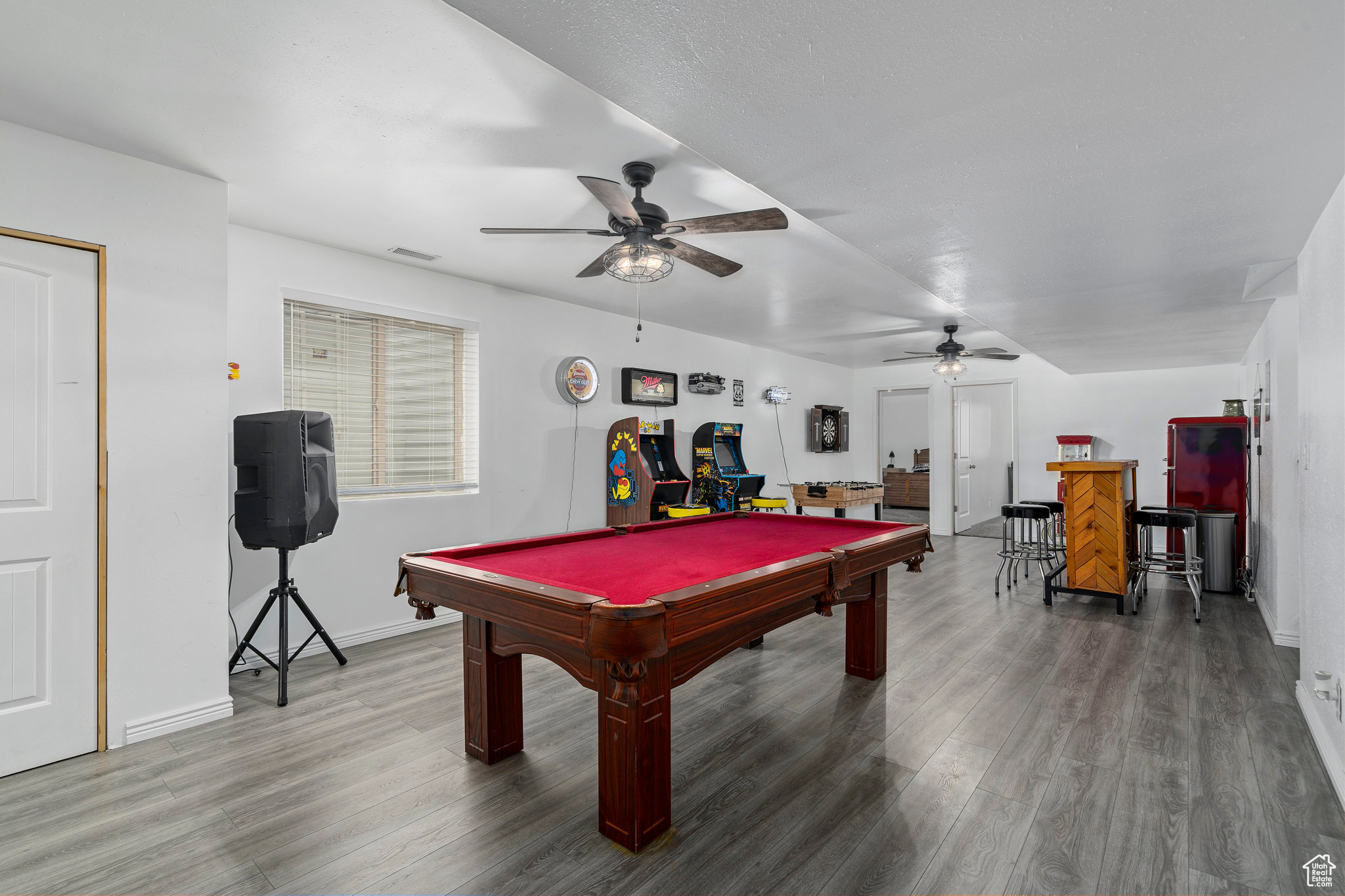 Rec room featuring wood-type flooring, ceiling fan, and billiards