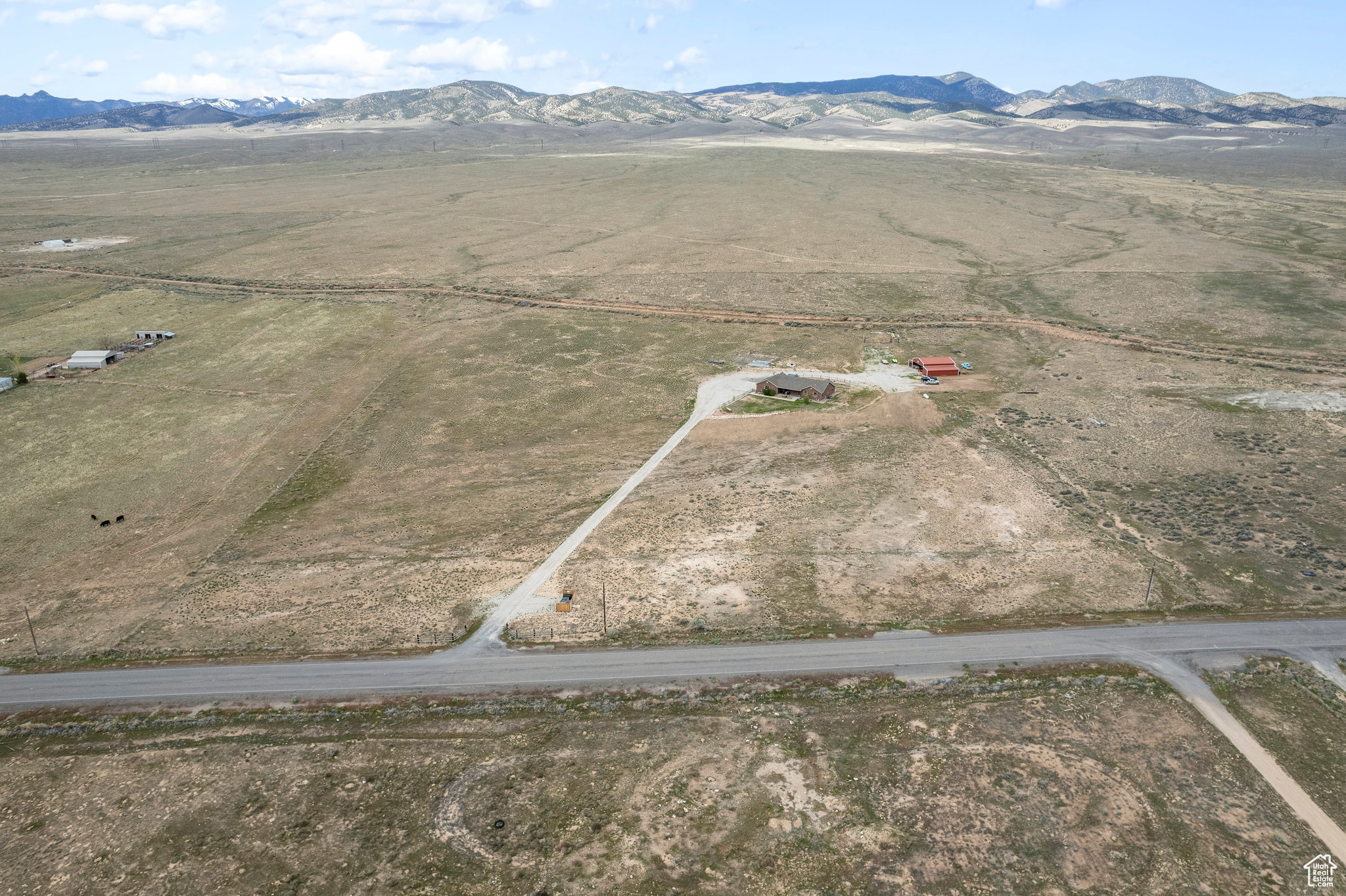 Birds eye view of property featuring a mountain view and a rural view