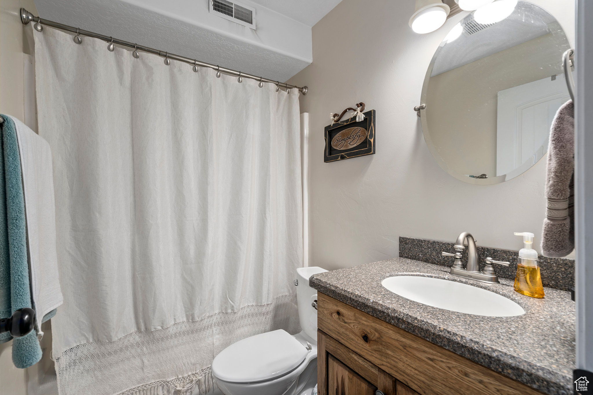 Bathroom with toilet and vanity