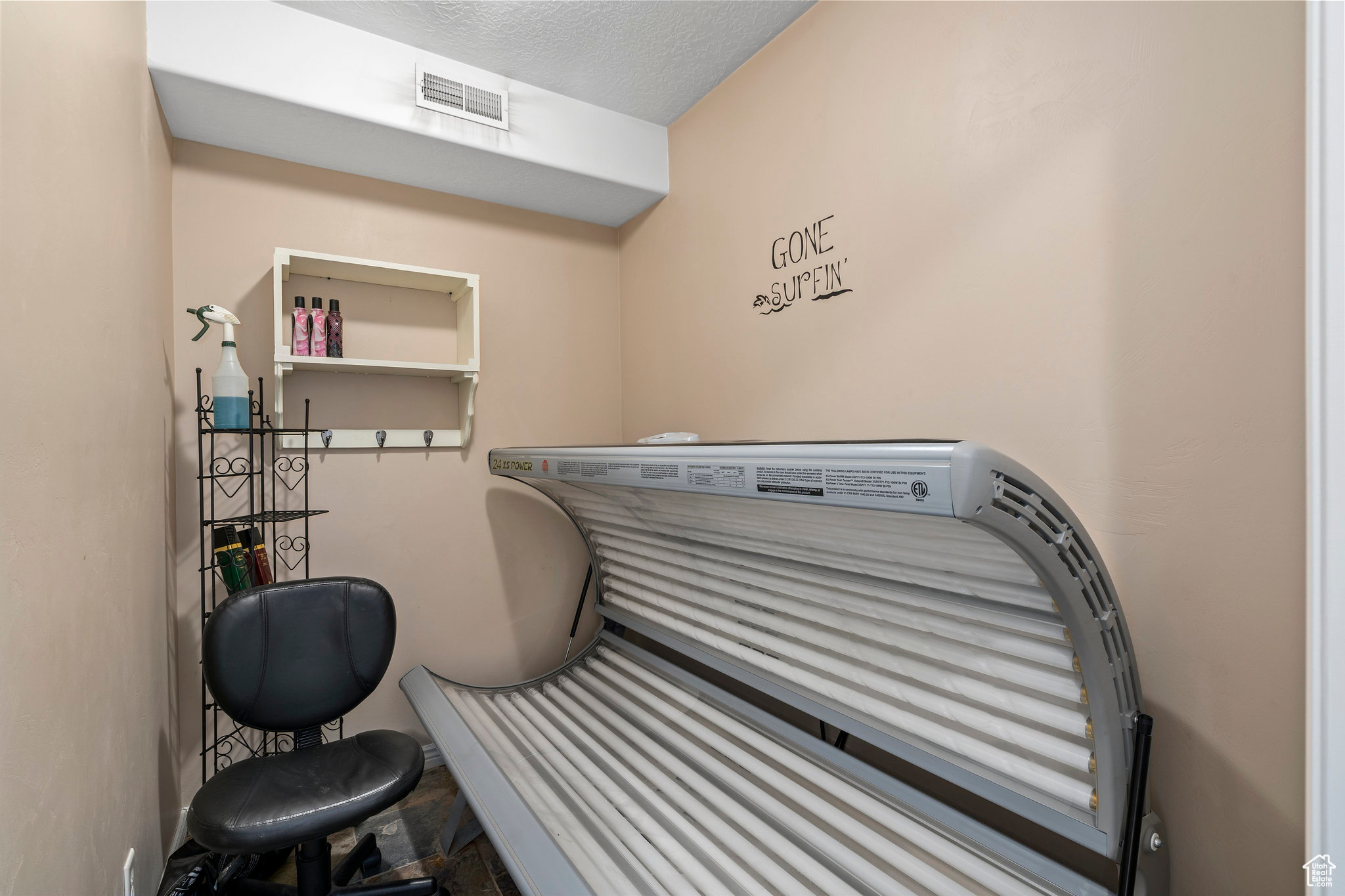 Miscellaneous room with a textured ceiling