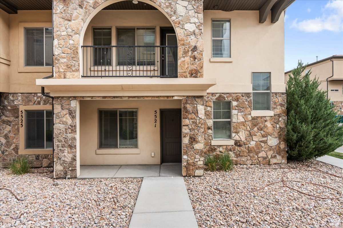 View of front of home featuring a balcony