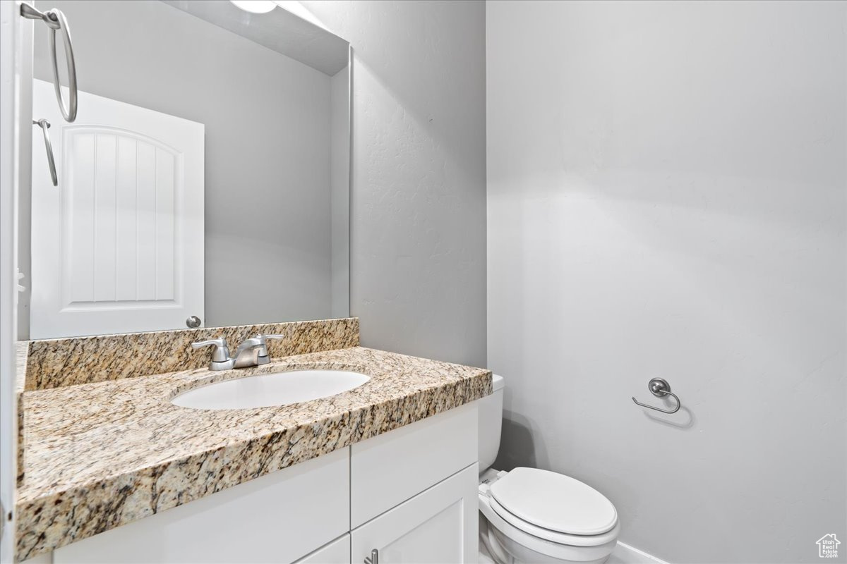 Bathroom featuring toilet and oversized vanity