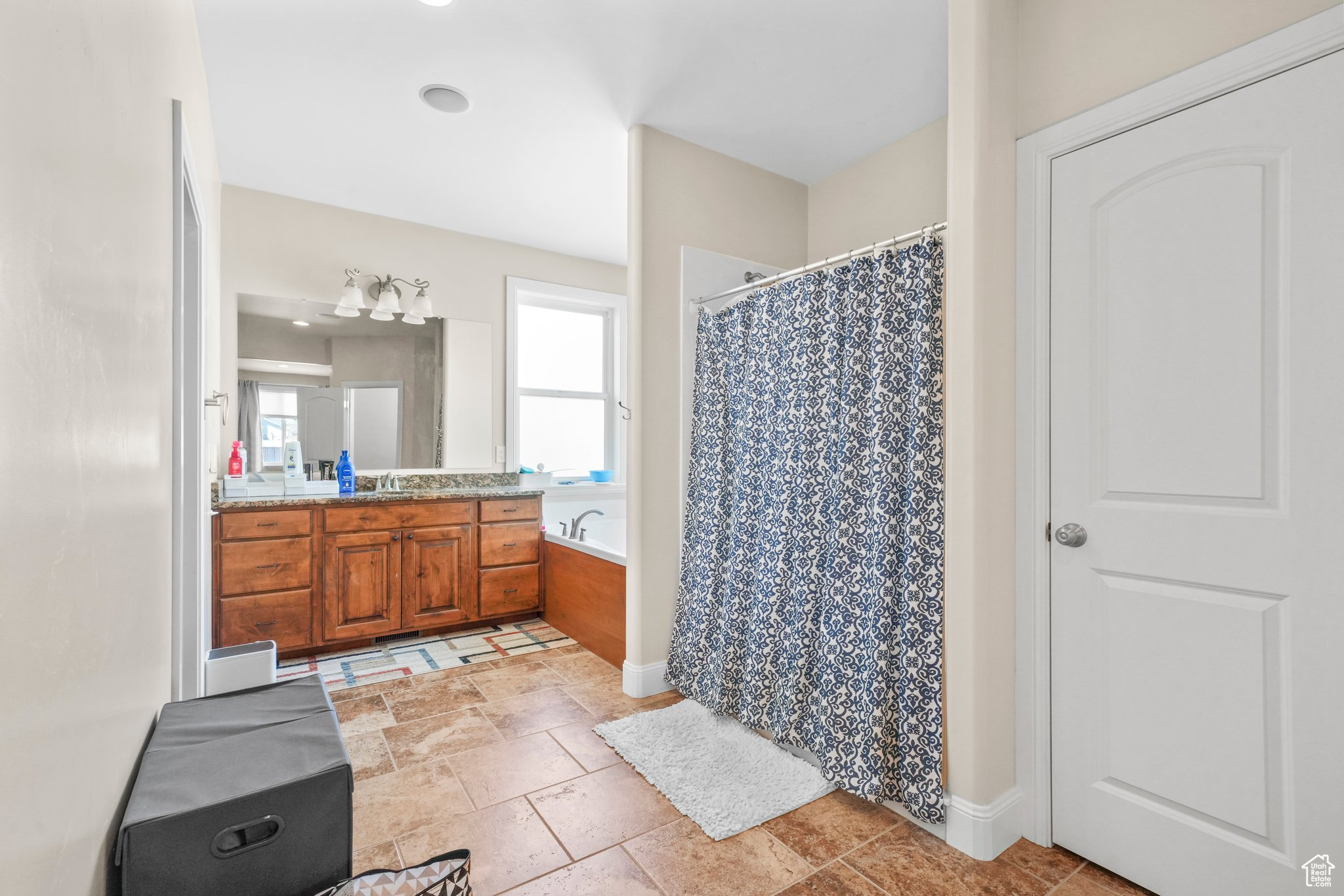 Master Bathroom with tile flooring and vanity