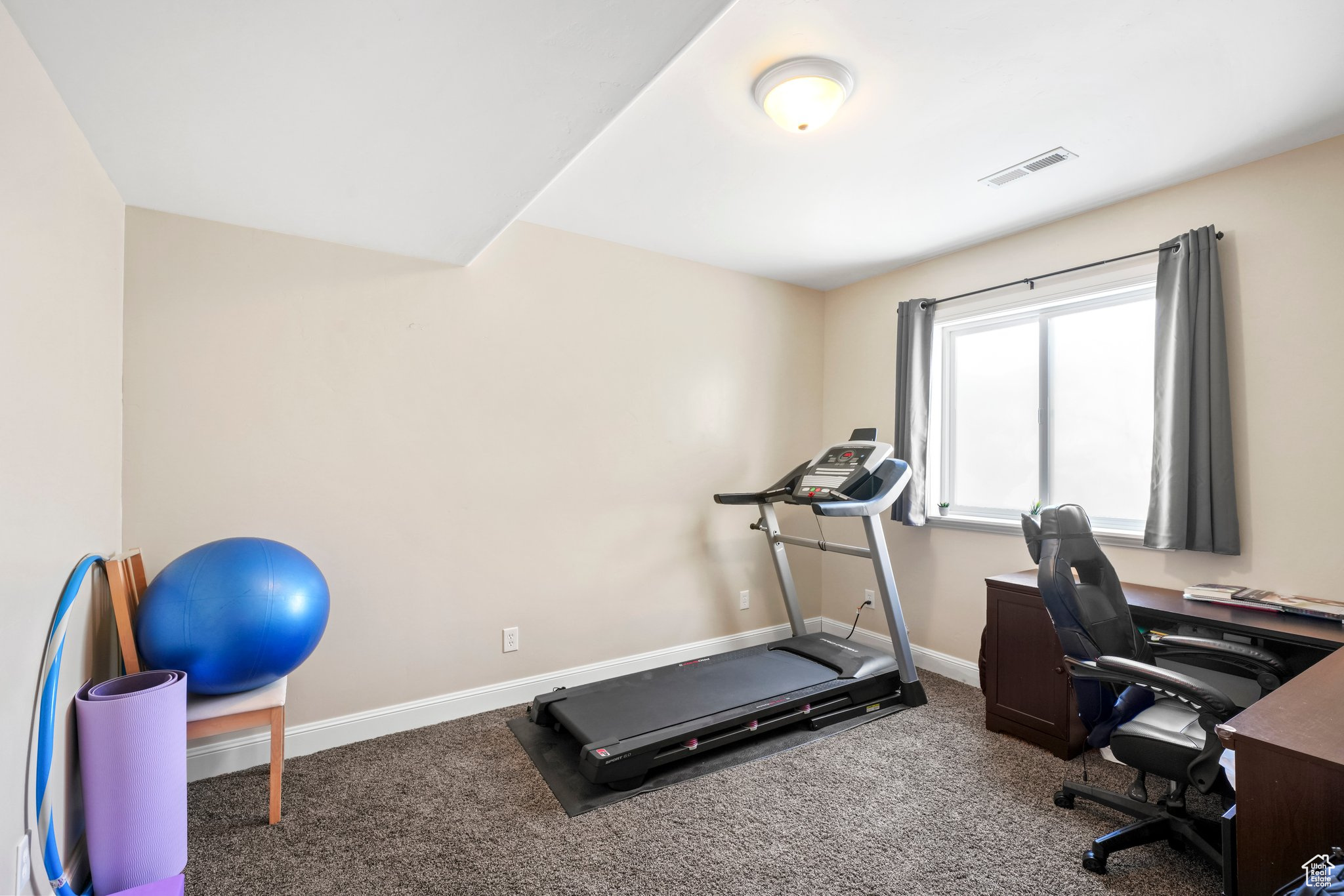 Exercise area featuring carpet flooring