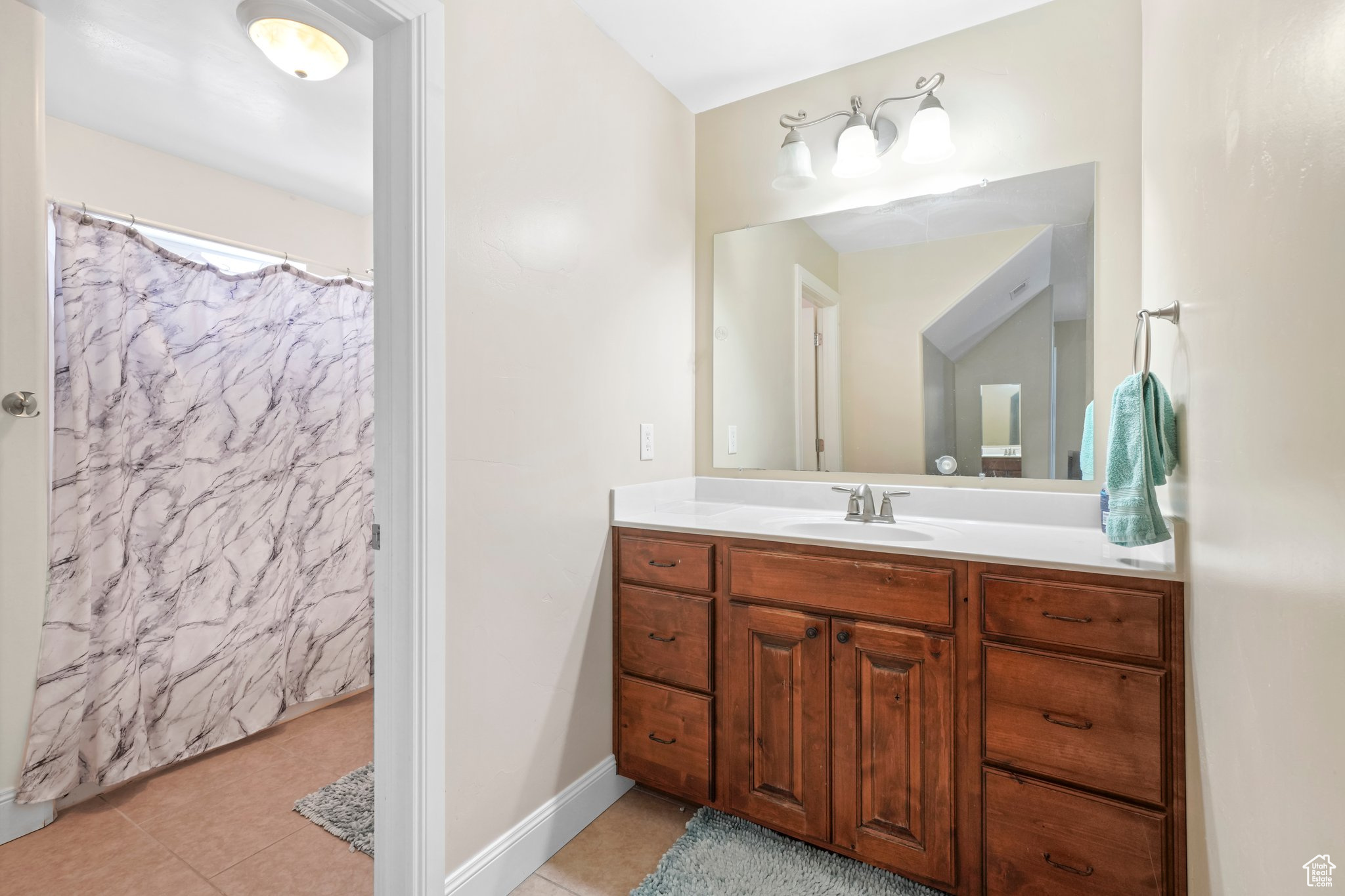 Bathroom with tile flooring and vanity