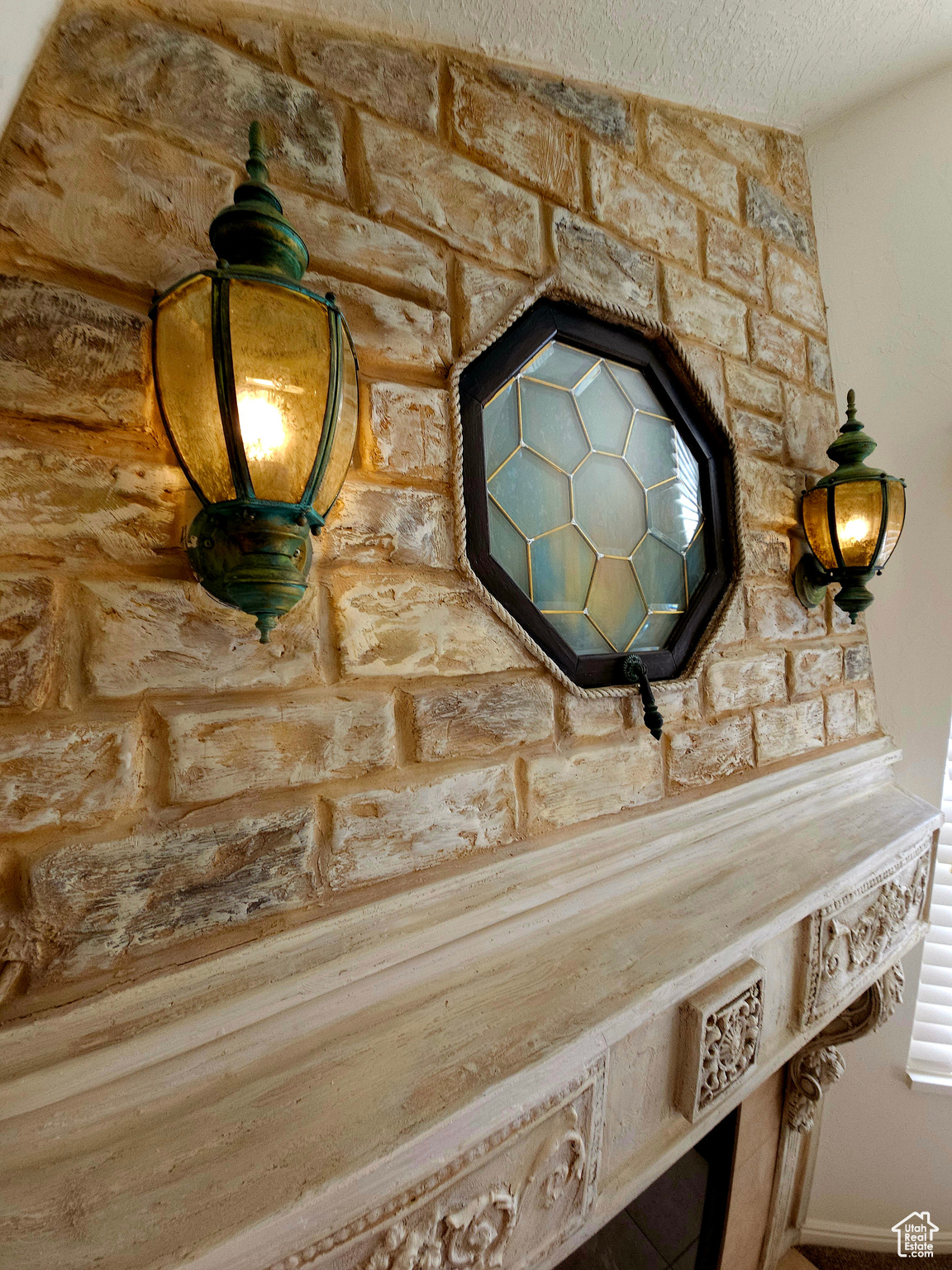 Architectural detailing and millwork featured on the fireplace hood.