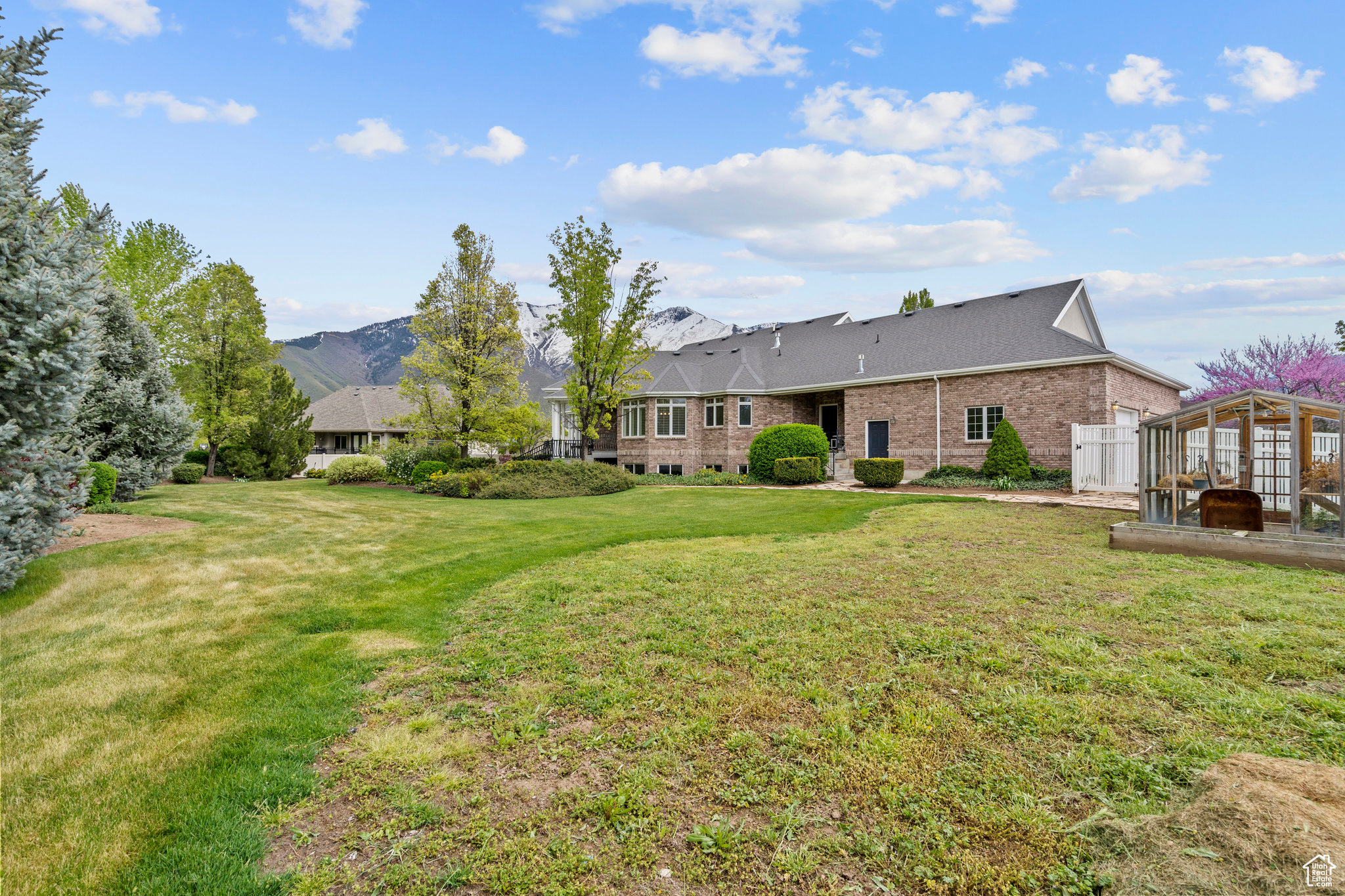 Rear view of house with a yard