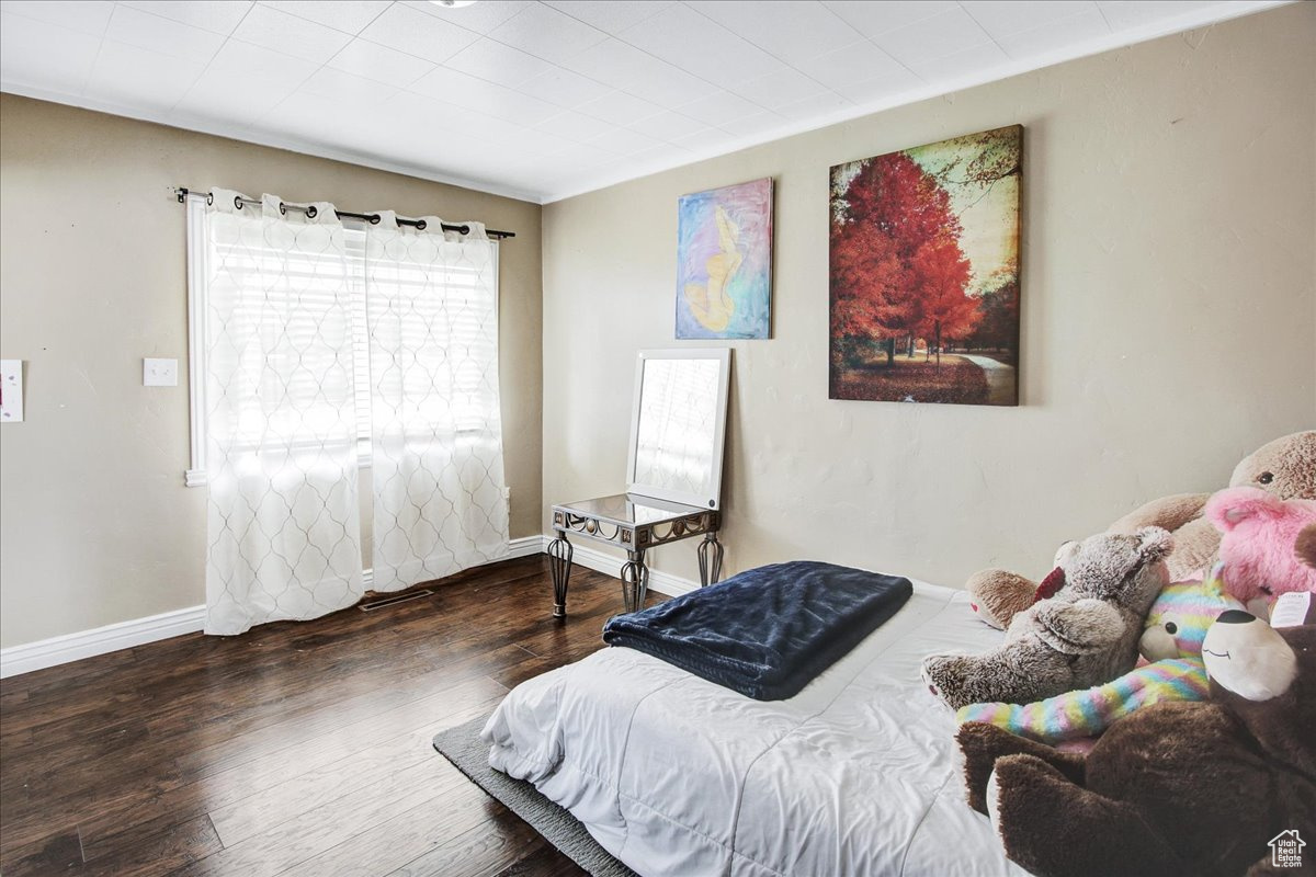 Bedroom featuring dark hardwood / wood-style flooring