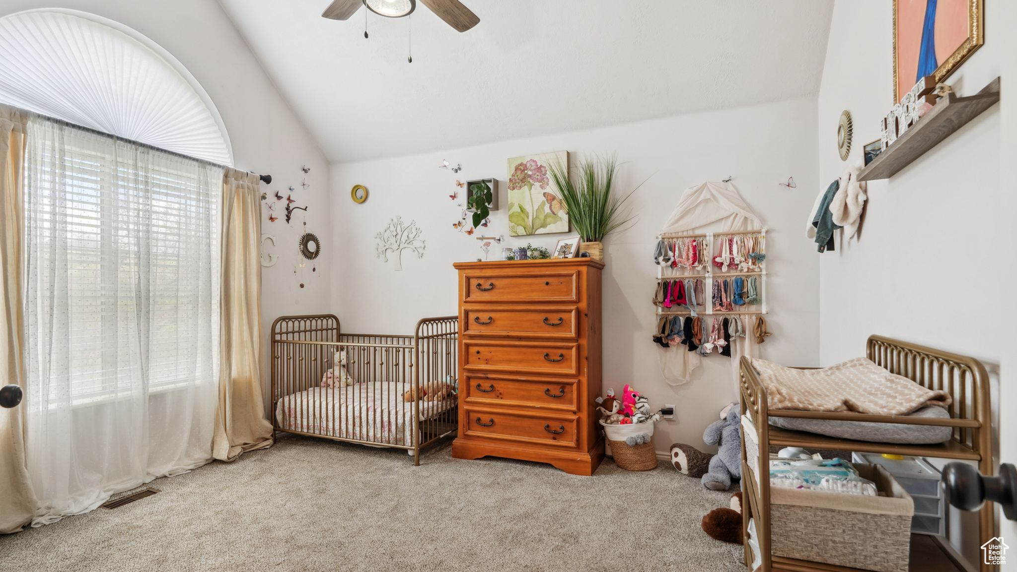 Office or Bedroom featuring ceiling fan, a crib, carpet floors, and lofted ceiling. No closet in this room.