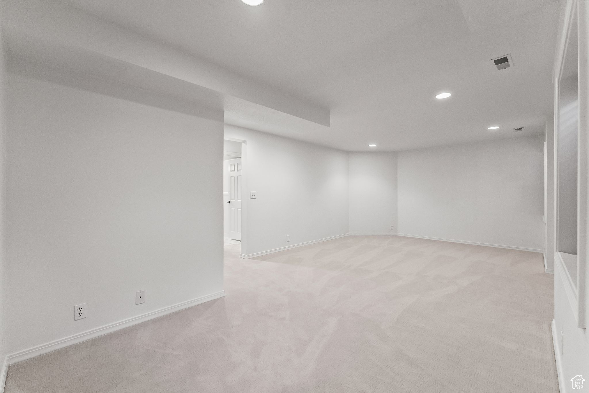 Basement featuring light carpet and recessed lighting