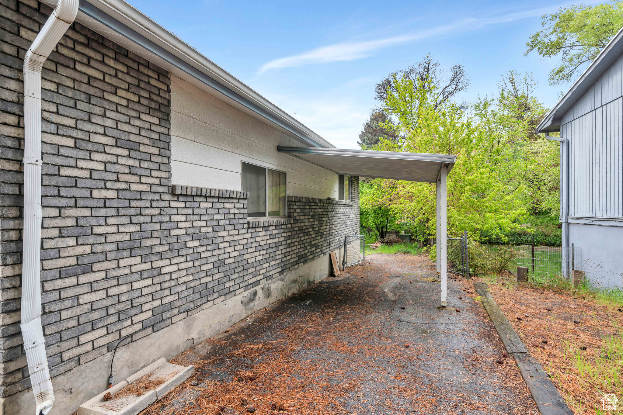 View of side of property with RV parking or extra parking for the basement resident