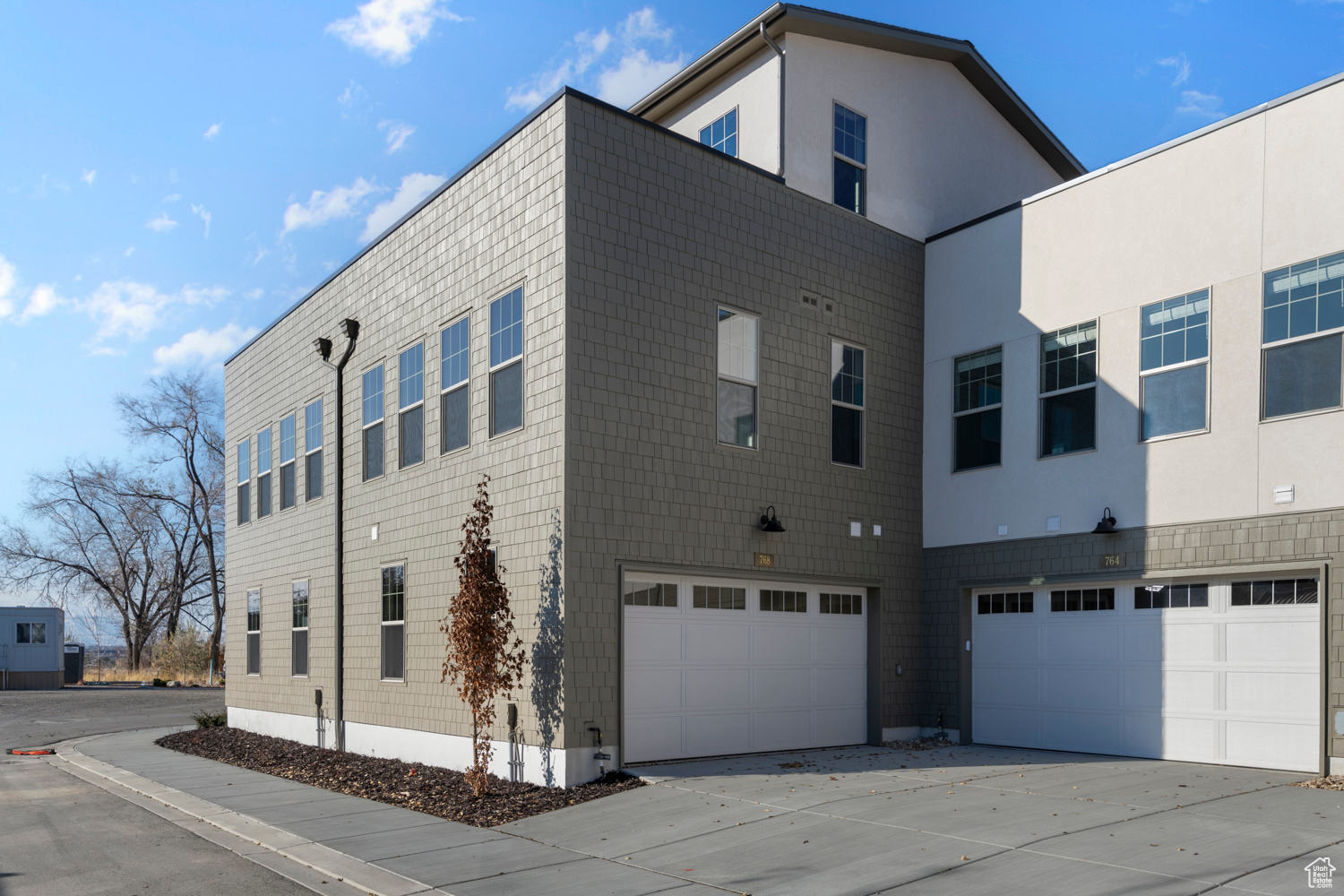 View of side of property with a garage