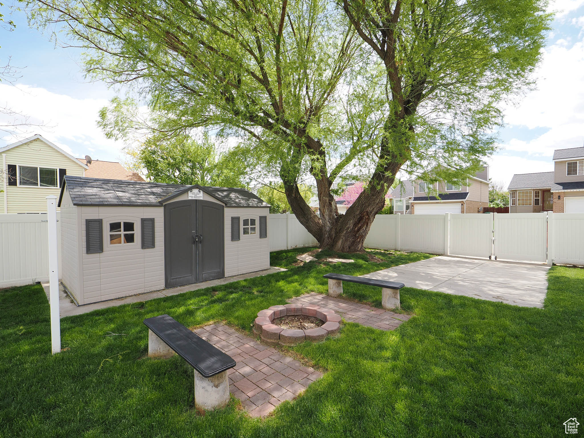 View of yard featuring RV Pad, an outdoor fire pit, and a shed