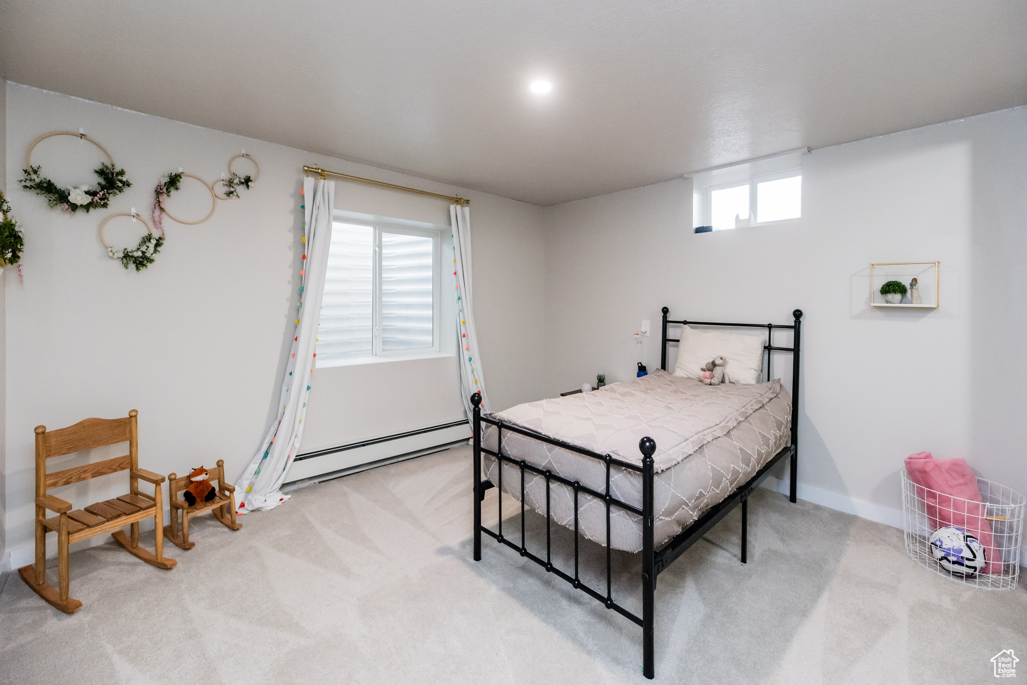 Bedroom featuring carpet flooring and baseboard heating