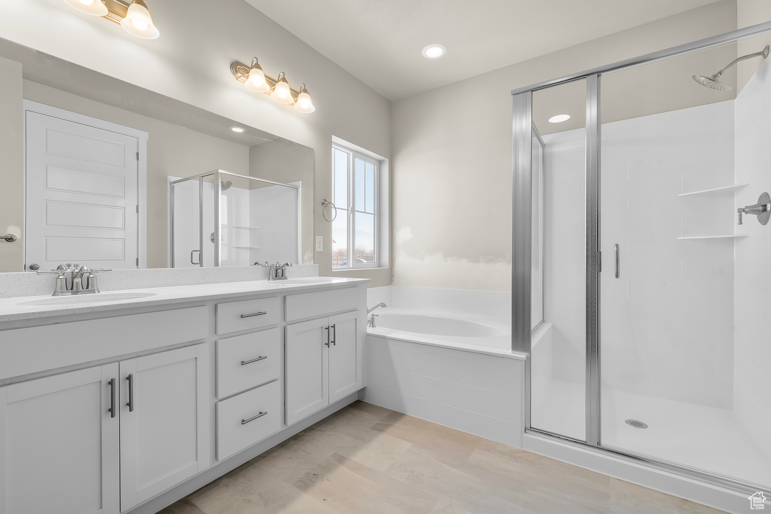 Bathroom with independent shower and bath, oversized vanity, and double sink