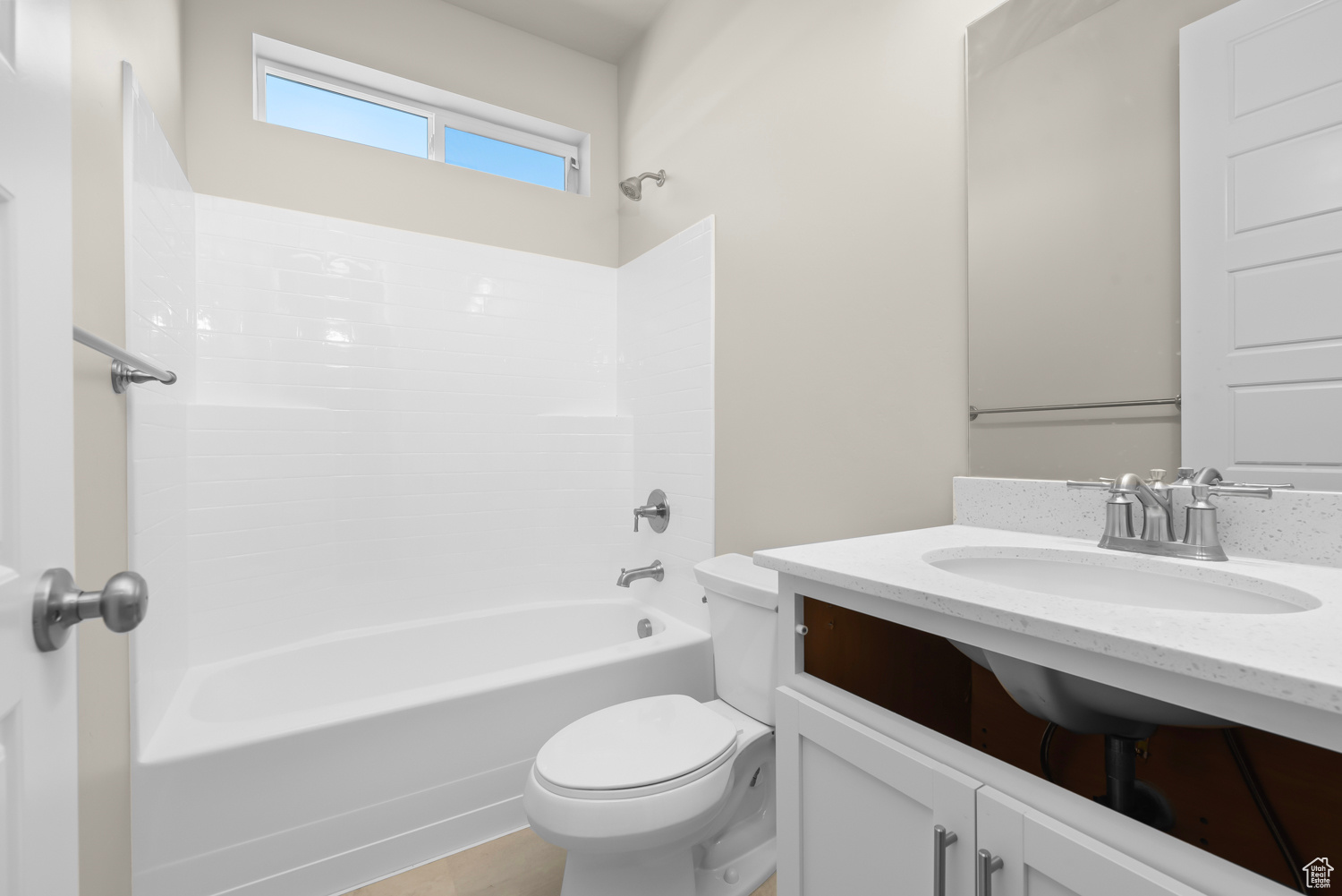 Full bathroom featuring washtub / shower combination, large vanity, and toilet